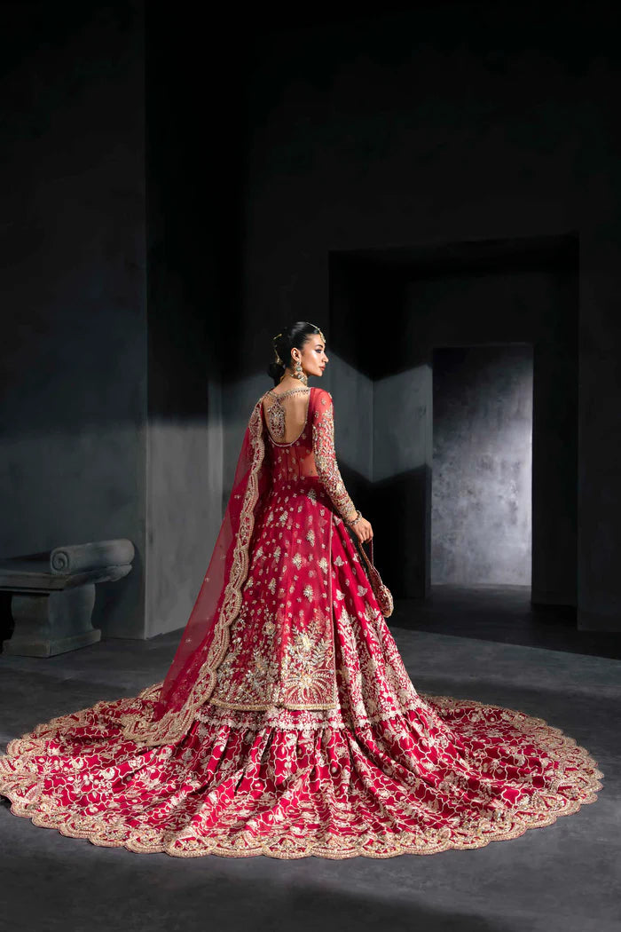 Deep crimson bridal lehenga with gold embroidery, full sleeves, flared skirt, and dramatic dupatta – perfect for overseas Pakistani and Indian brides.