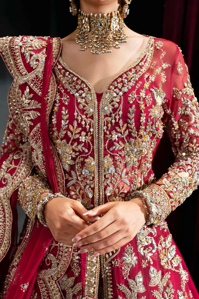 Deep crimson bridal lehenga with gold embroidery, full sleeves, flared skirt, and dramatic dupatta – perfect for overseas Pakistani and Indian brides.