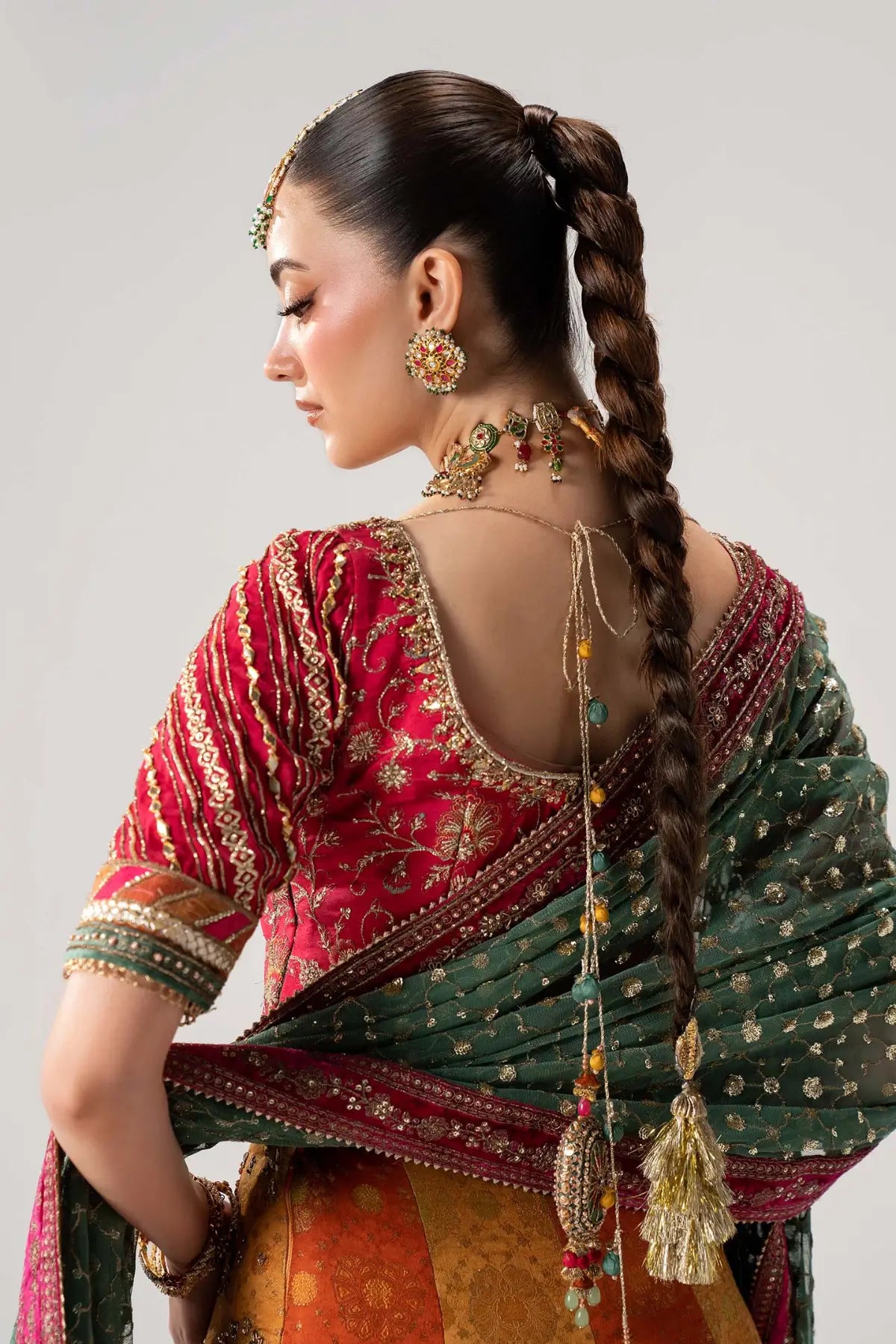 Merjan multicolor Mehndi Jamawar lehenga choli with embellished blouse and net dupatta by Maria B