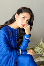 Blue raw silk formal dress with embellished borders and organza dupatta.