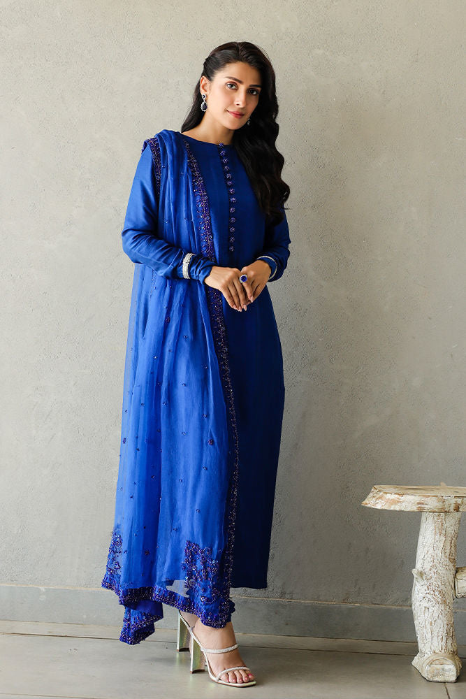 Blue raw silk formal dress with embellished borders and organza dupatta.