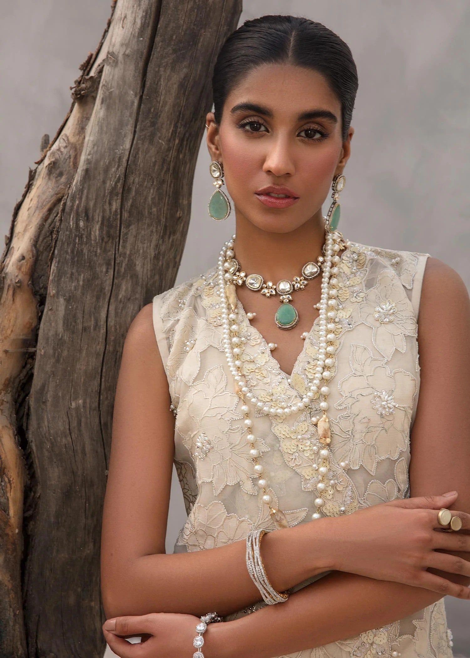 Angrakha crossover shirt in Korean raw silk with crystal florals and silk pants.