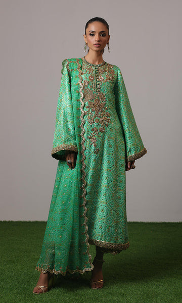 Green raw silk chunri print outfit with gold handwork, scalloped chiffon dupatta, and teal embroidered ezaar – NAOW-554 by Pakistanimoda