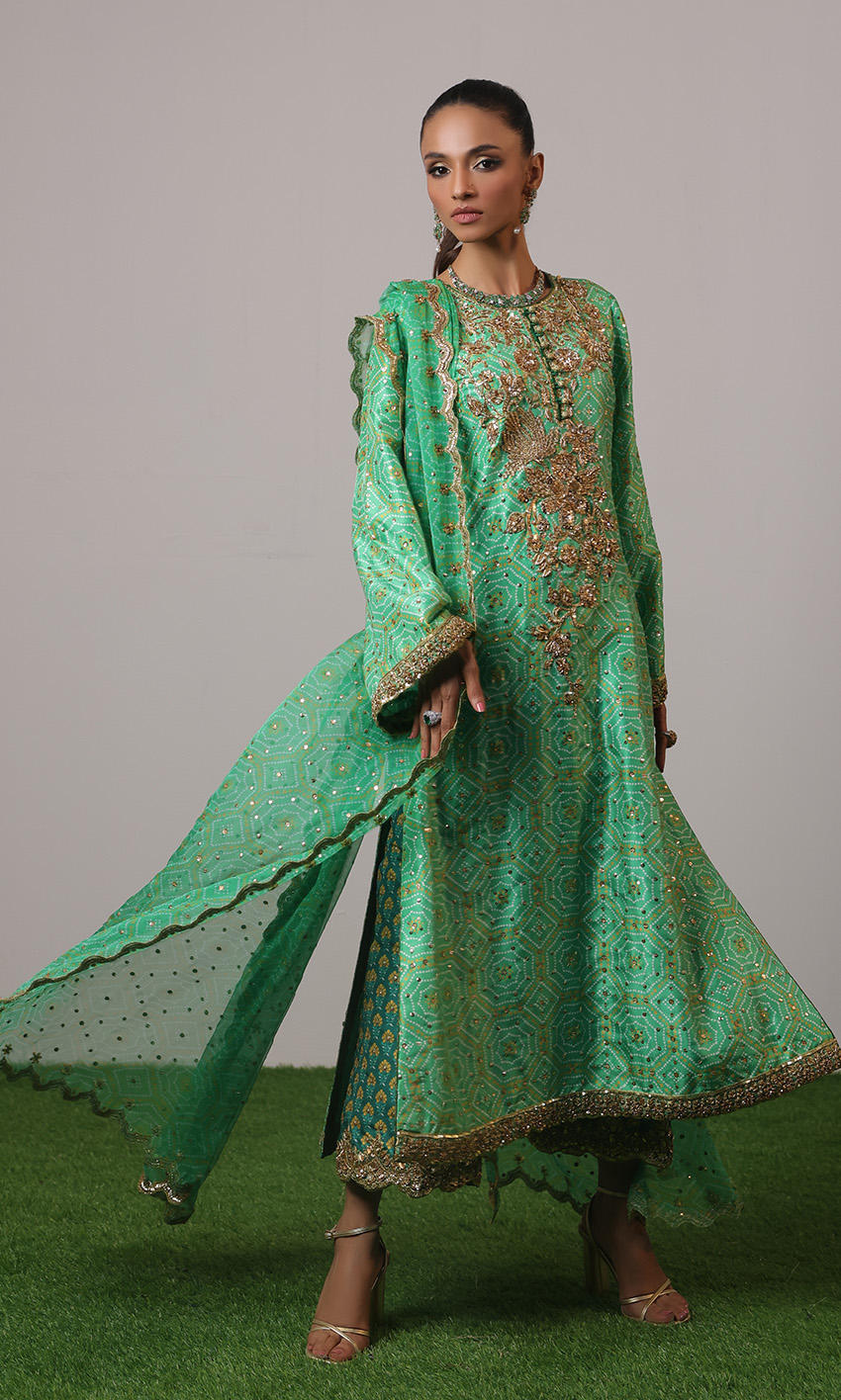 Green raw silk chunri print outfit with gold handwork, scalloped chiffon dupatta, and teal embroidered ezaar – NAOW-554 by Pakistanimoda