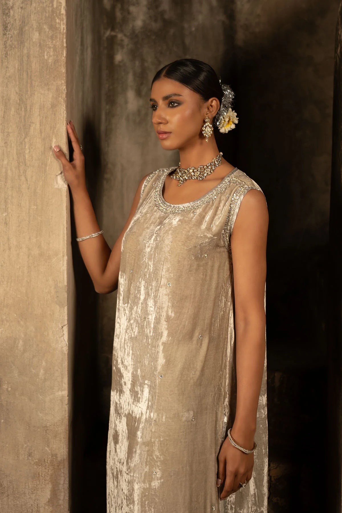 Nude velvet halter shirt with silver embellishments, pearl hangings, silk pants, and organza dupatta with silver hem – perfect for formal events 2025.