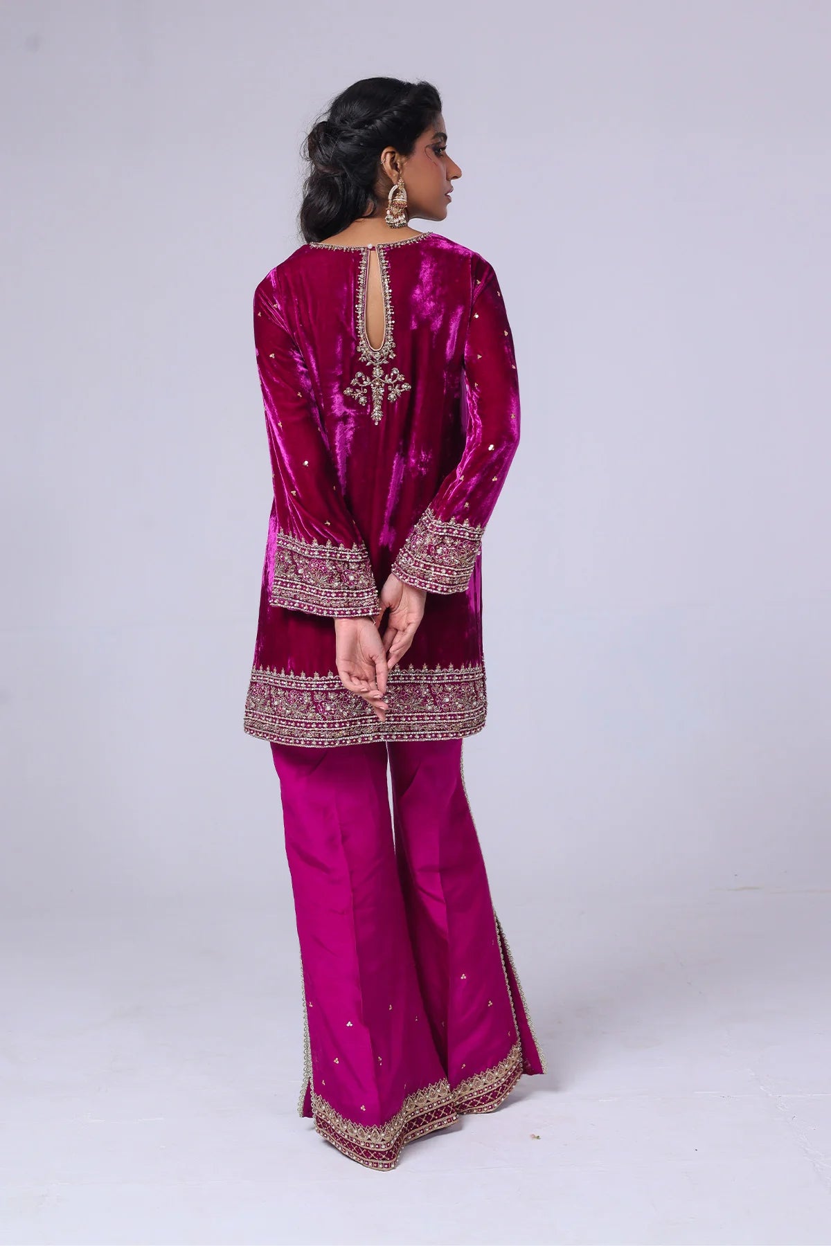 Viva magenta velvet short shirt with hand sequins, tilla, gold lace, raw silk pants with slits, and matching organza dupatta – perfect partywear 2025.
