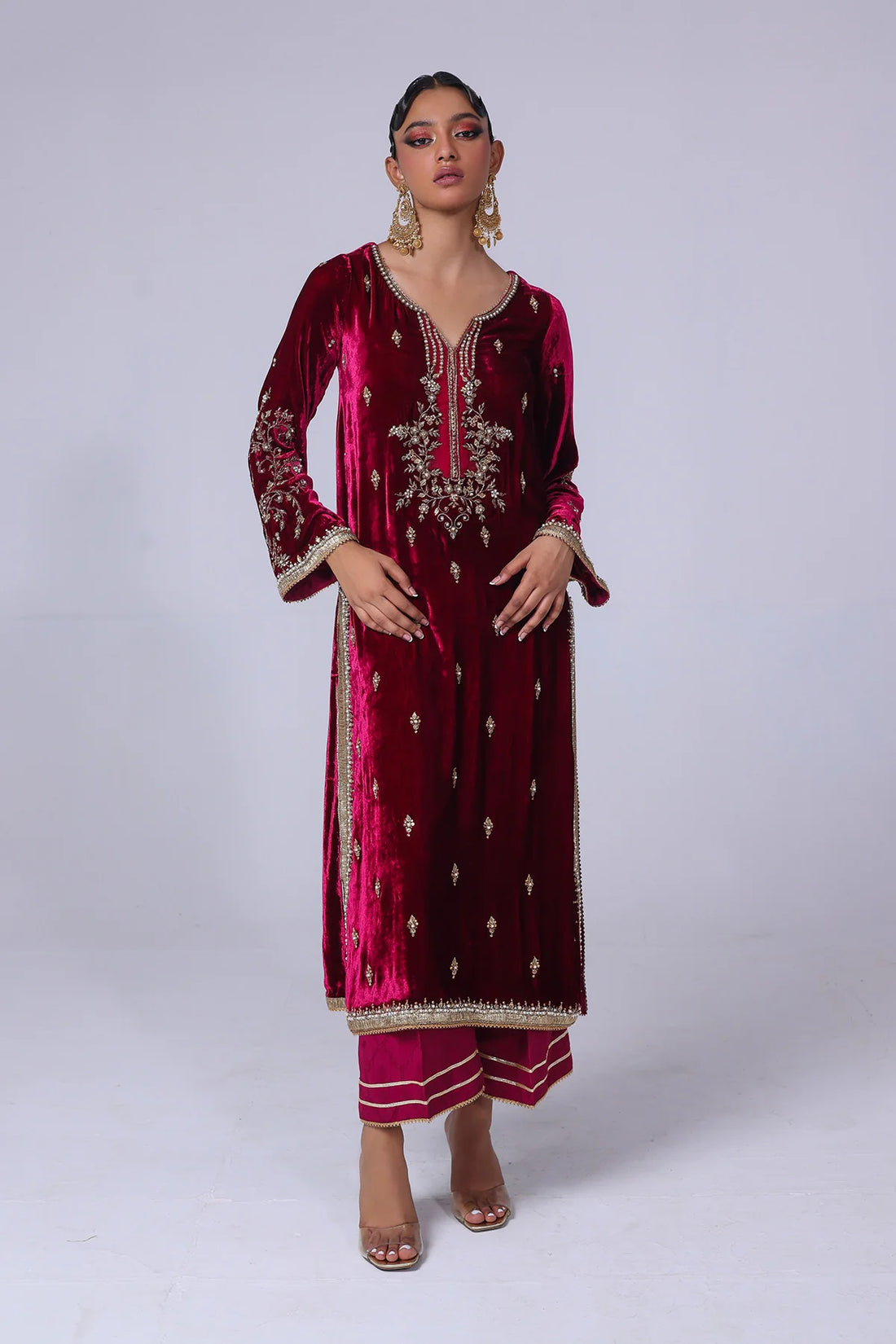 Cherry velvet shirt with naqshi, gota, and cut dana handwork, paired with embossed silk pants and matching organza dupatta – formal wear for 2025.

