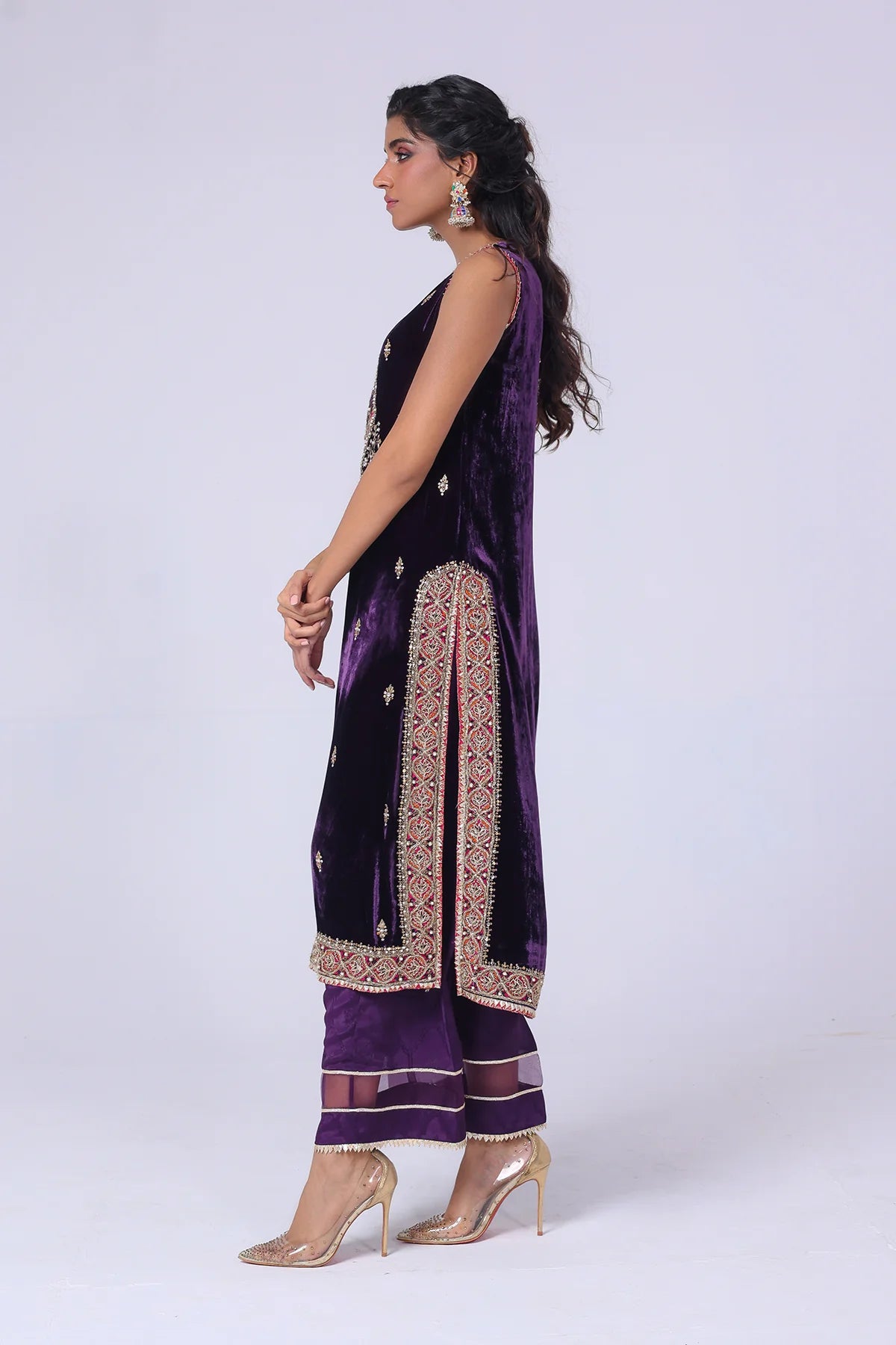 Deep purple velvet shirt with cotton net zari neckline, hand embellishments, silk pants with organza hem, and matching dupatta – formal wear 2025.
