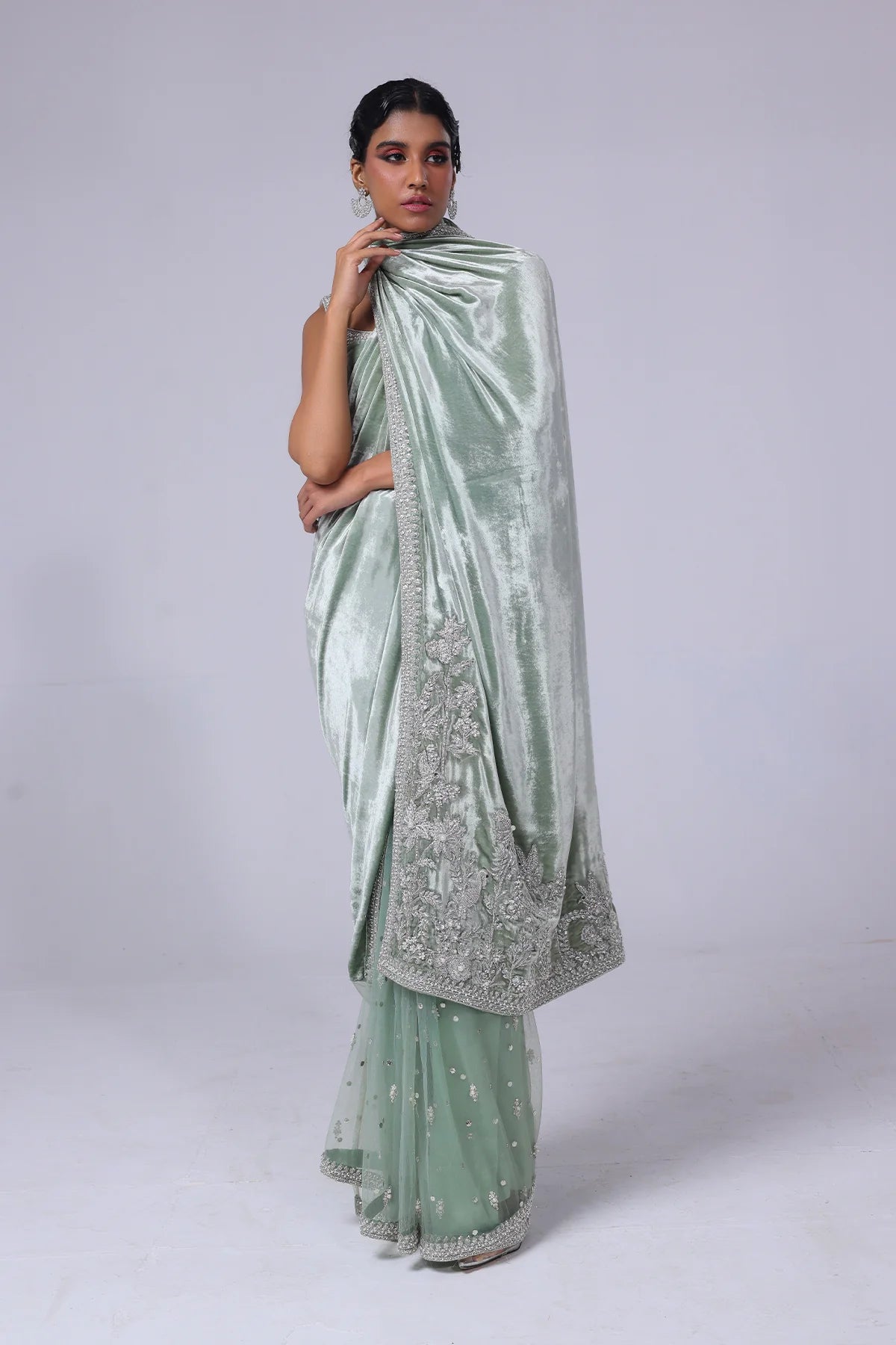 Light green Pakistani saree with velvet pallu, net mukesh fall, and silver embellished blouse – ideal for receptions and formal events in 2025.