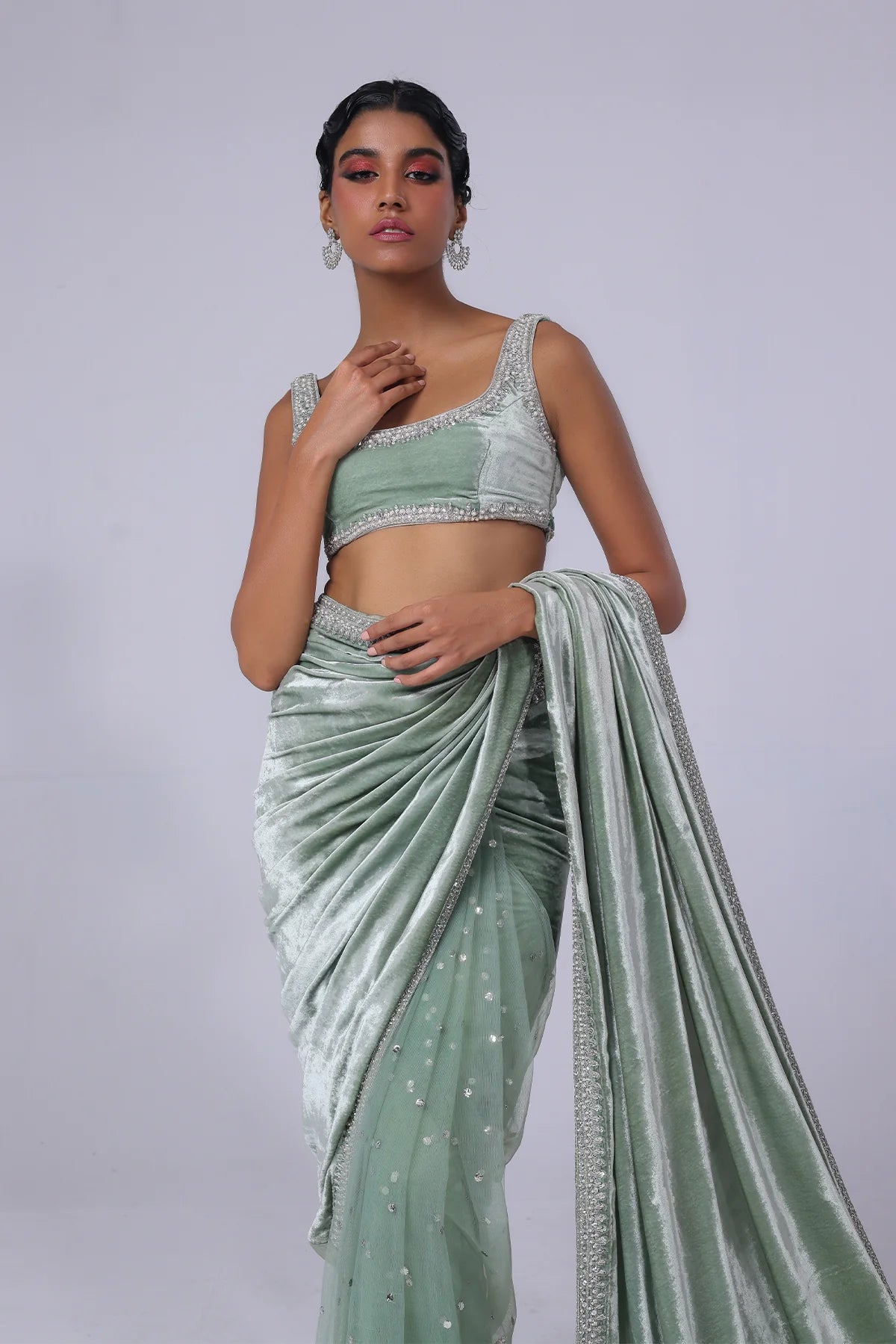 Light green Pakistani saree with velvet pallu, net mukesh fall, and silver embellished blouse – ideal for receptions and formal events in 2025.