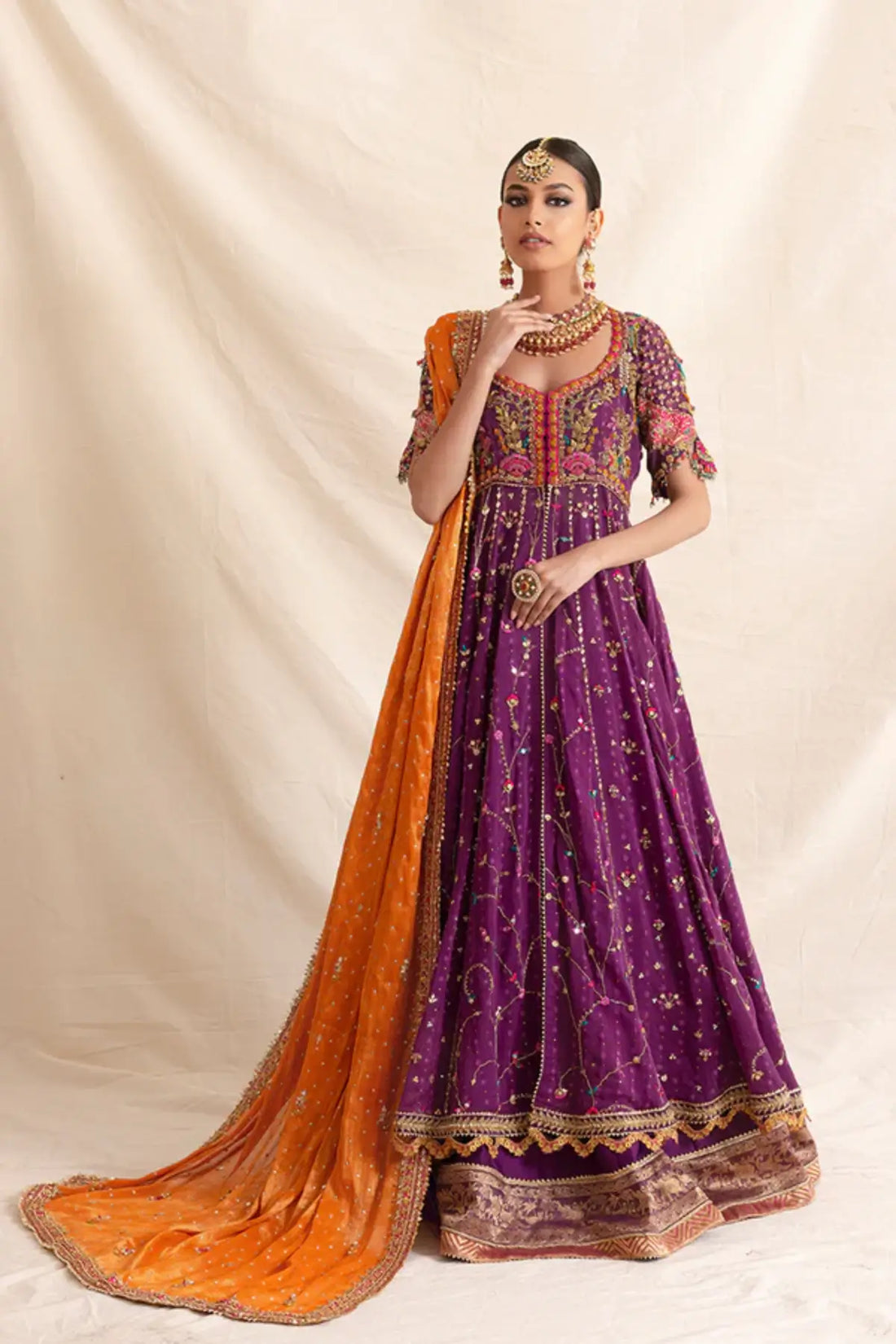 Nadira Purple Zardozi Cotton Net Pishwas with Intricate Embellishments, Silk Lehenga and Contrasting Orange Lame Dupatta