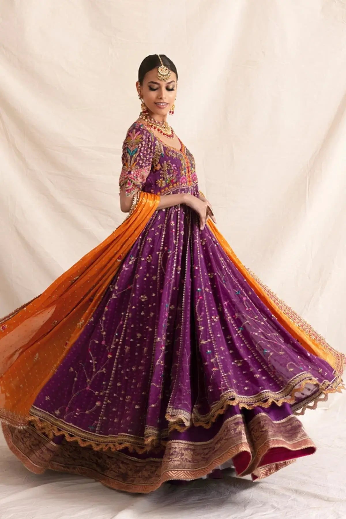 Nadira Purple Zardozi Cotton Net Pishwas with Intricate Embellishments, Silk Lehenga and Contrasting Orange Lame Dupatta