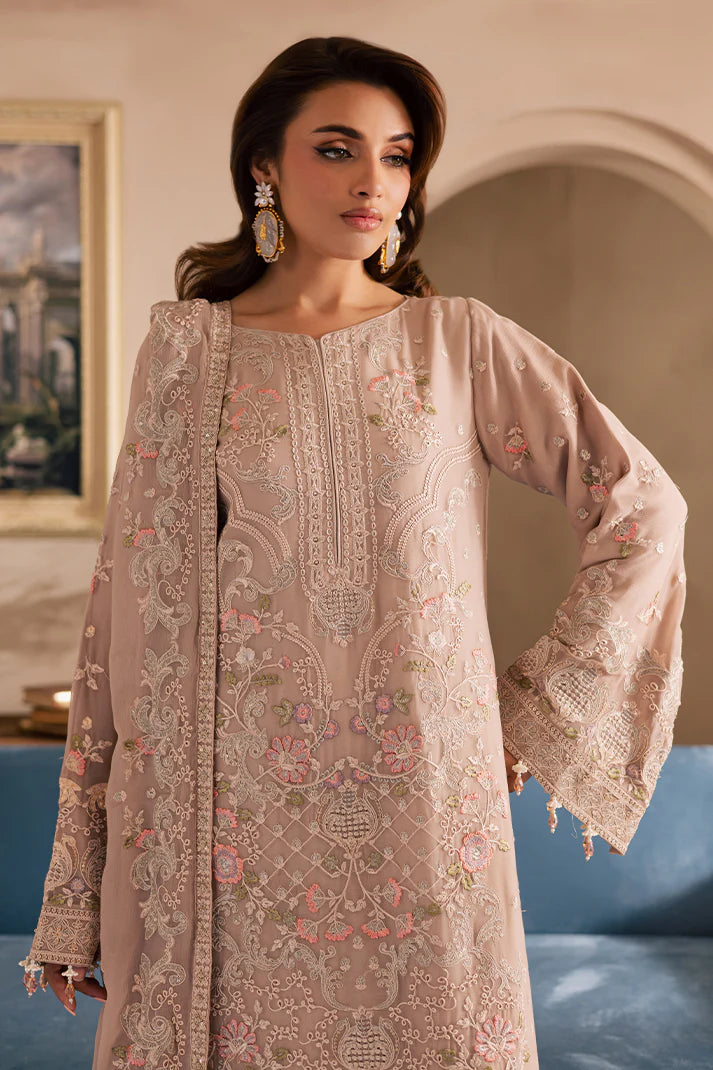 Peach pink embroidered chiffon suit with organza borders and raw silk trousers – perfect for Pakistani wedding guests in USA, UK, and Canada.


