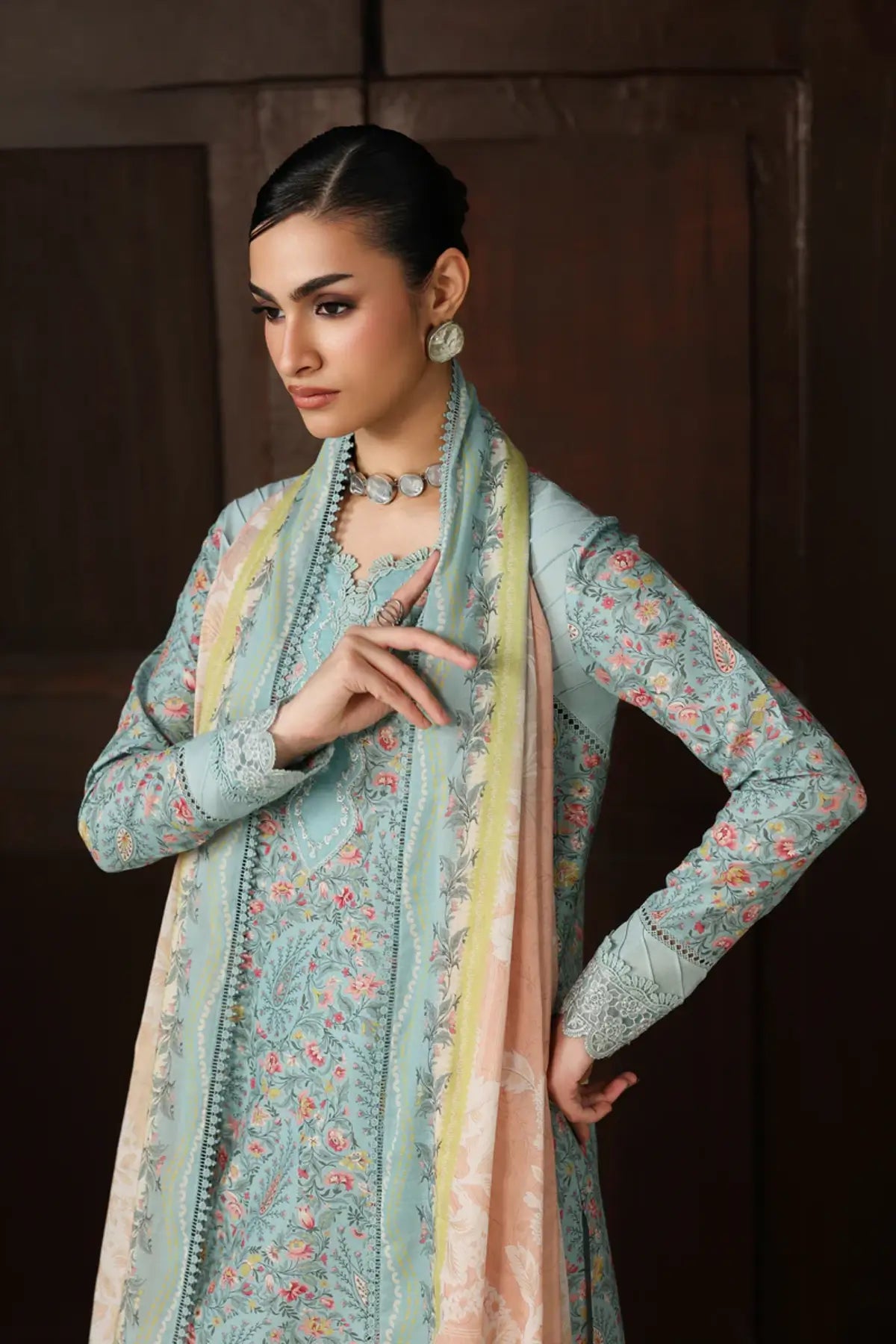 Nazia QQP-04(A) by Qalamkar ice blue lawn stitched 3PC suit with embroidered neckline, printed lawn dupatta, and plain cotton trousers.