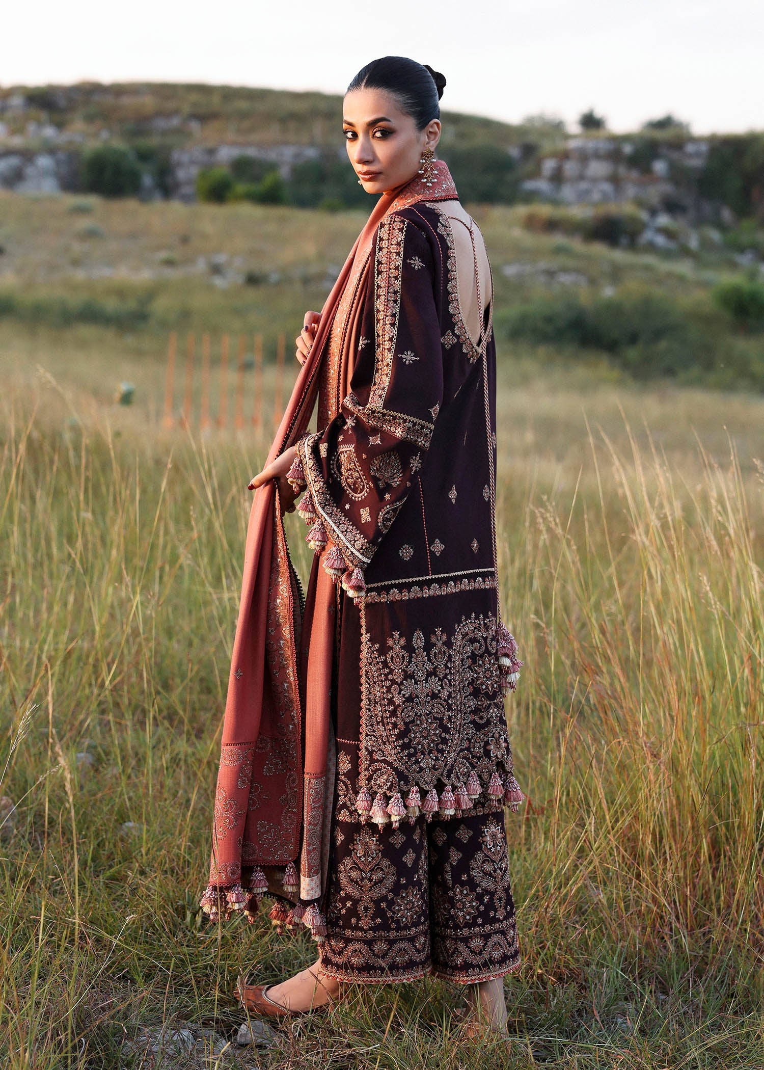 Nazneen Hussain Rehar plum embroidered khaddar stitched suit with peach wool shawl at Pakistanimoda.