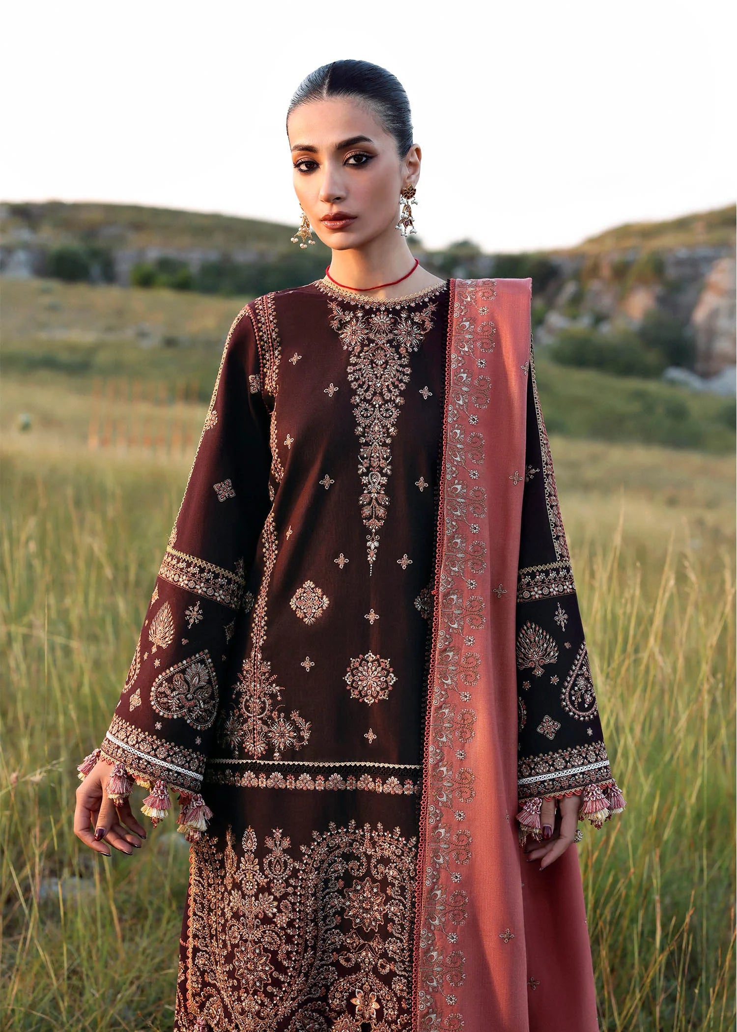 Nazneen Hussain Rehar plum embroidered khaddar stitched suit with peach wool shawl at Pakistanimoda.