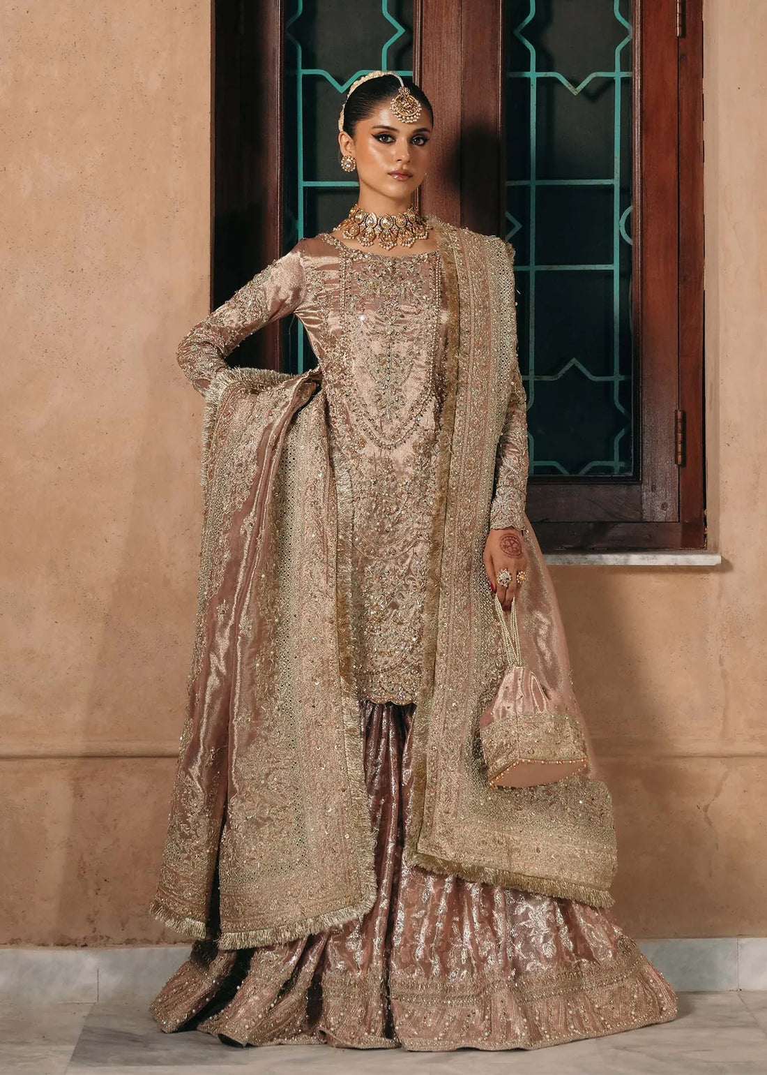 Nazo baby pink tissue gharara dress with embroidered shirt, badla fabric gharara, and tissue dupatta by Kanwal Malik from the Saheli Luxury Pret Collection.