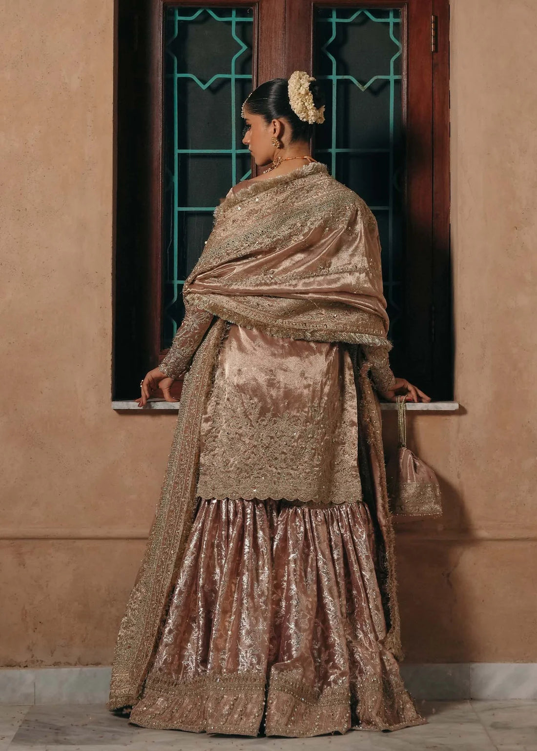 Nazo baby pink tissue gharara dress with embroidered shirt, badla fabric gharara, and tissue dupatta by Kanwal Malik from the Saheli Luxury Pret Collection.