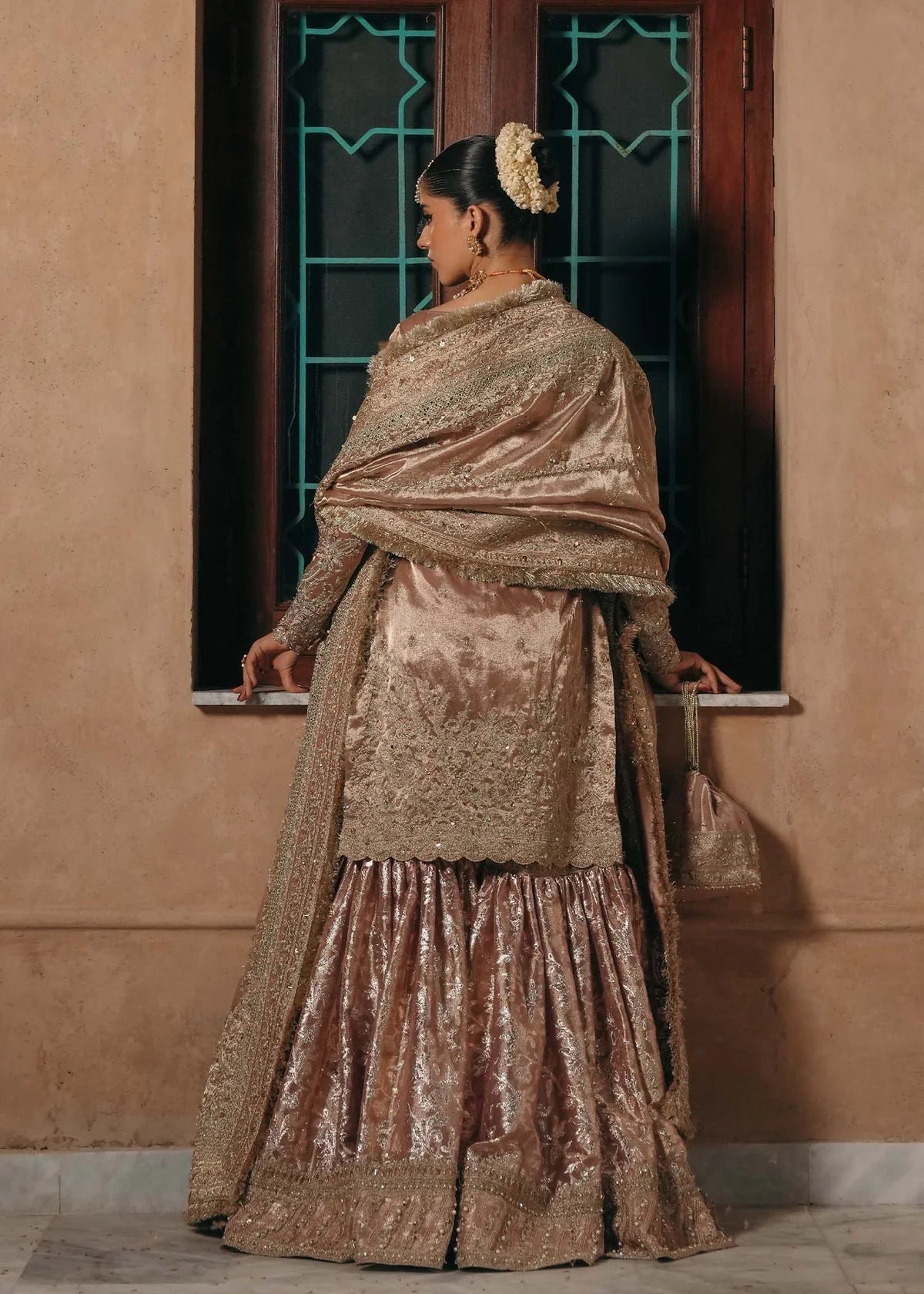 Nazo baby pink tissue gharara dress with embroidered shirt, badla fabric gharara, and tissue dupatta by Kanwal Malik from the Saheli Luxury Pret Collection.