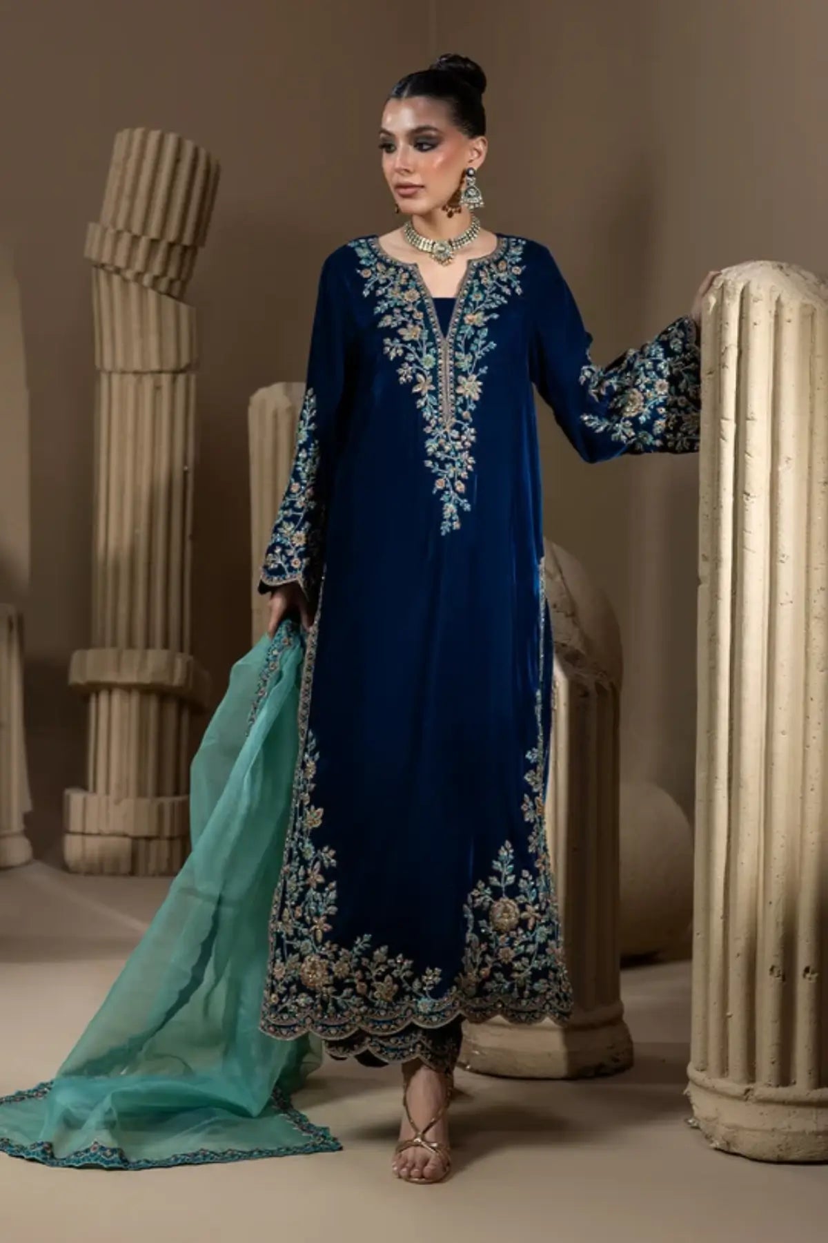 Neelum peacock teal embroidered velvet stitched formal kaftan with floral hand embellishments, Sheesha silk pants and organza dupatta.