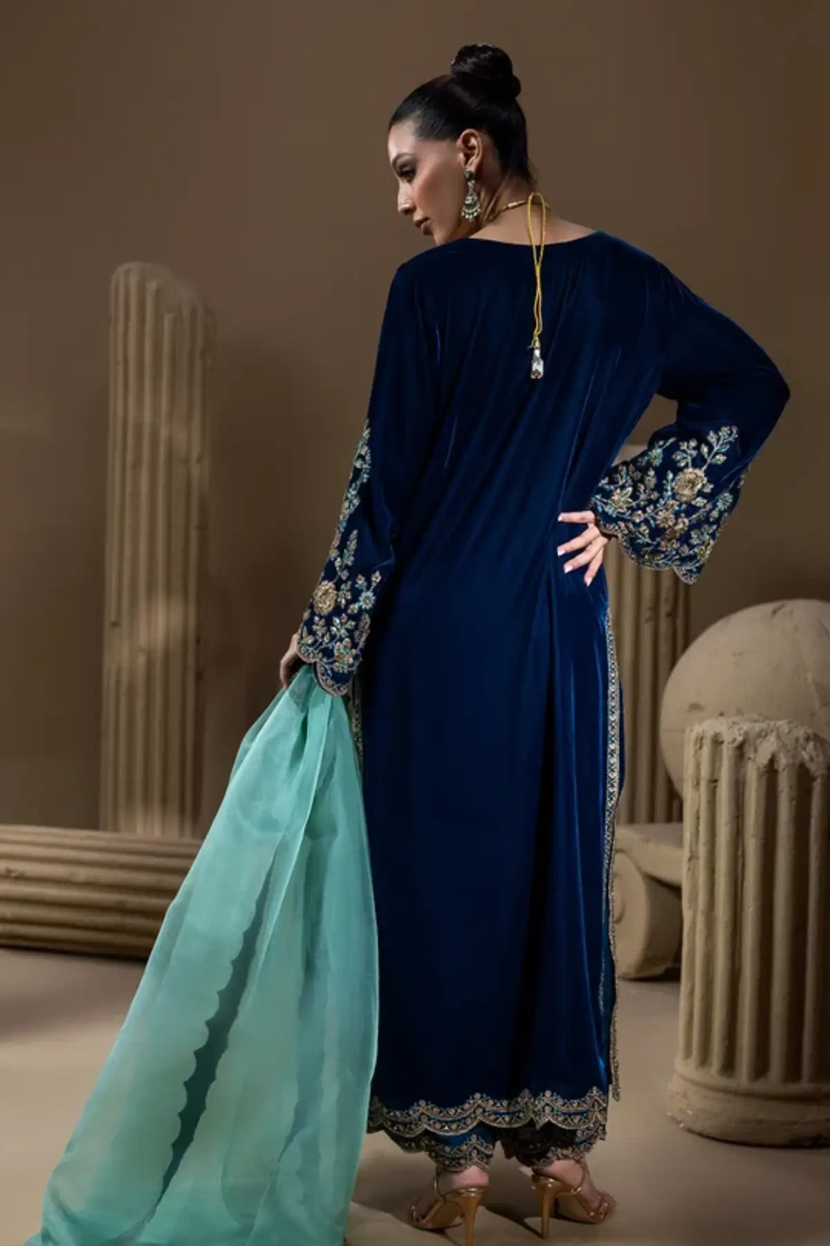 Neelum peacock teal embroidered velvet stitched formal kaftan with floral hand embellishments, Sheesha silk pants and organza dupatta.