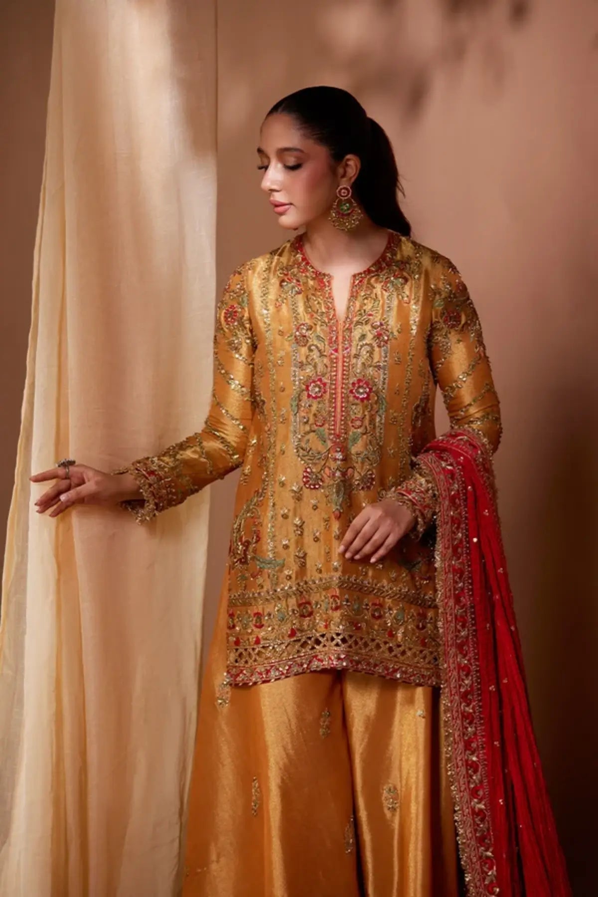 Nikita Burnt Orange Zardozi Lame Mehndi Night Stitched Suit with Mughal Embroidery, Lame Lehenga Pants and Red Silk Net Dupatta