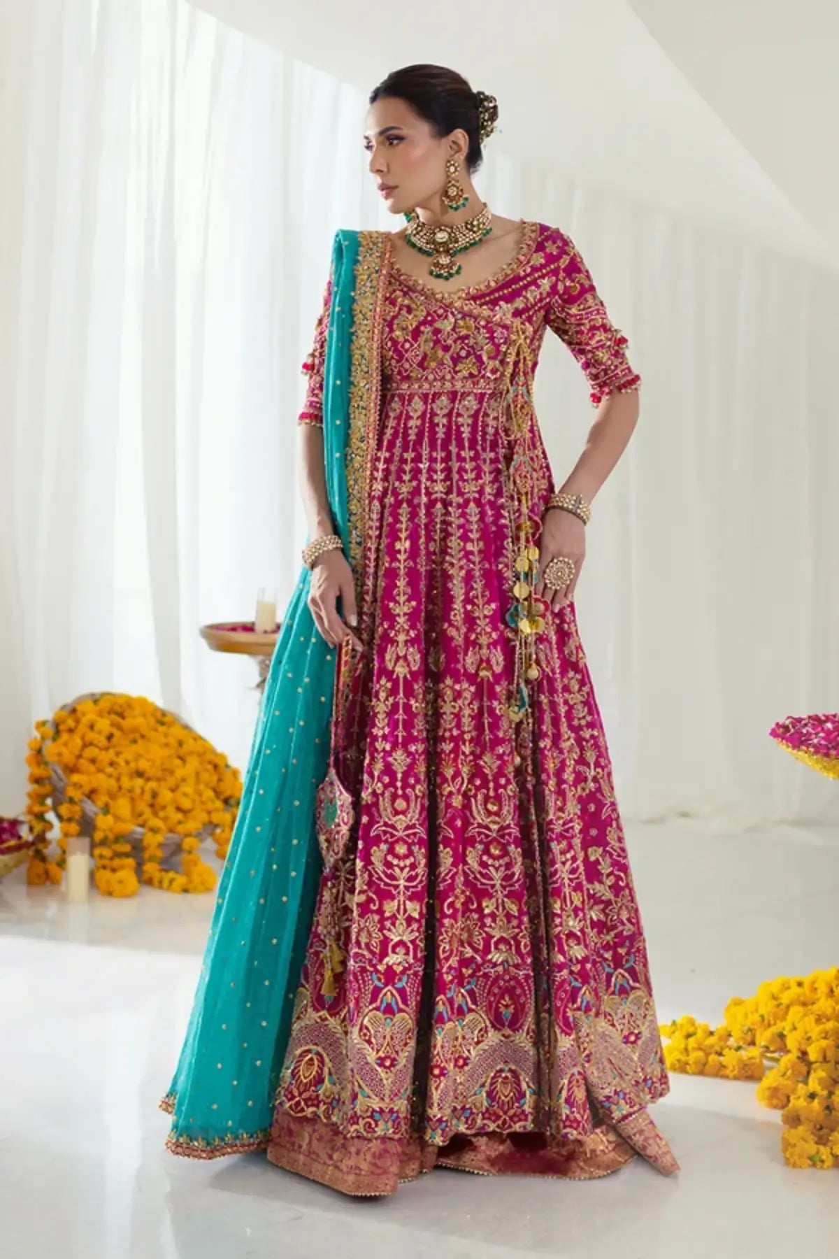 Niloufer Dark Pink Cotton Net Wedding Pishwas with Intricate Gold Embroidery, Cotton Silk Lehenga, Firozi Silk Net Dupatta and Embellished Pouch