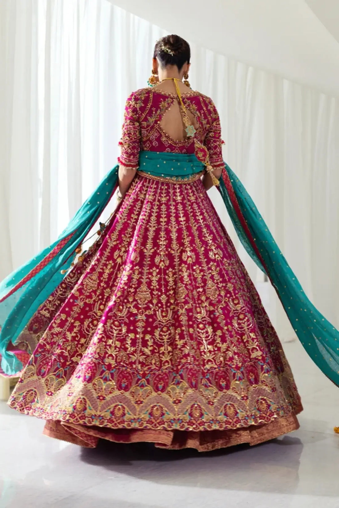 Niloufer Dark Pink Cotton Net Wedding Pishwas with Intricate Gold Embroidery, Cotton Silk Lehenga, Firozi Silk Net Dupatta and Embellished Pouch
