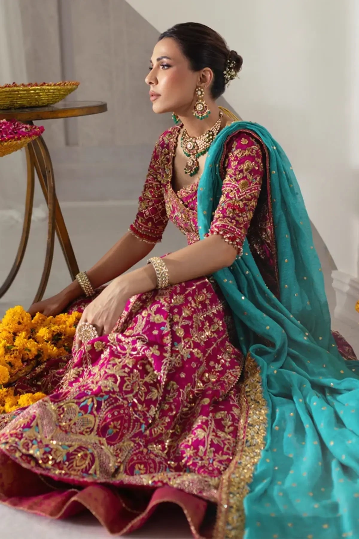 Niloufer Dark Pink Cotton Net Wedding Pishwas with Intricate Gold Embroidery, Cotton Silk Lehenga, Firozi Silk Net Dupatta and Embellished Pouch