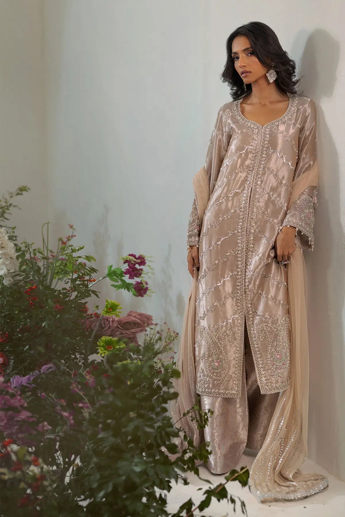 Salmon rose lamé front open jacket suit with zardozi and paisley detailing styled for festive celebrations