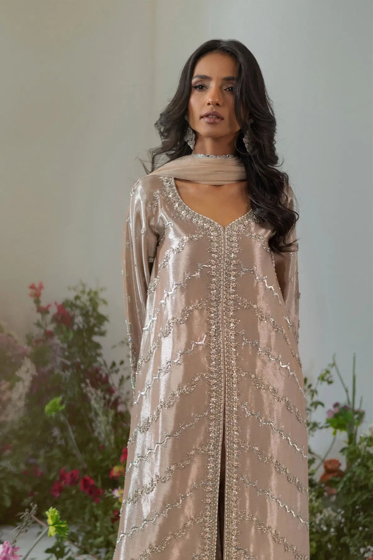 Salmon rose lamé front open jacket suit with zardozi and paisley detailing styled for festive celebrations