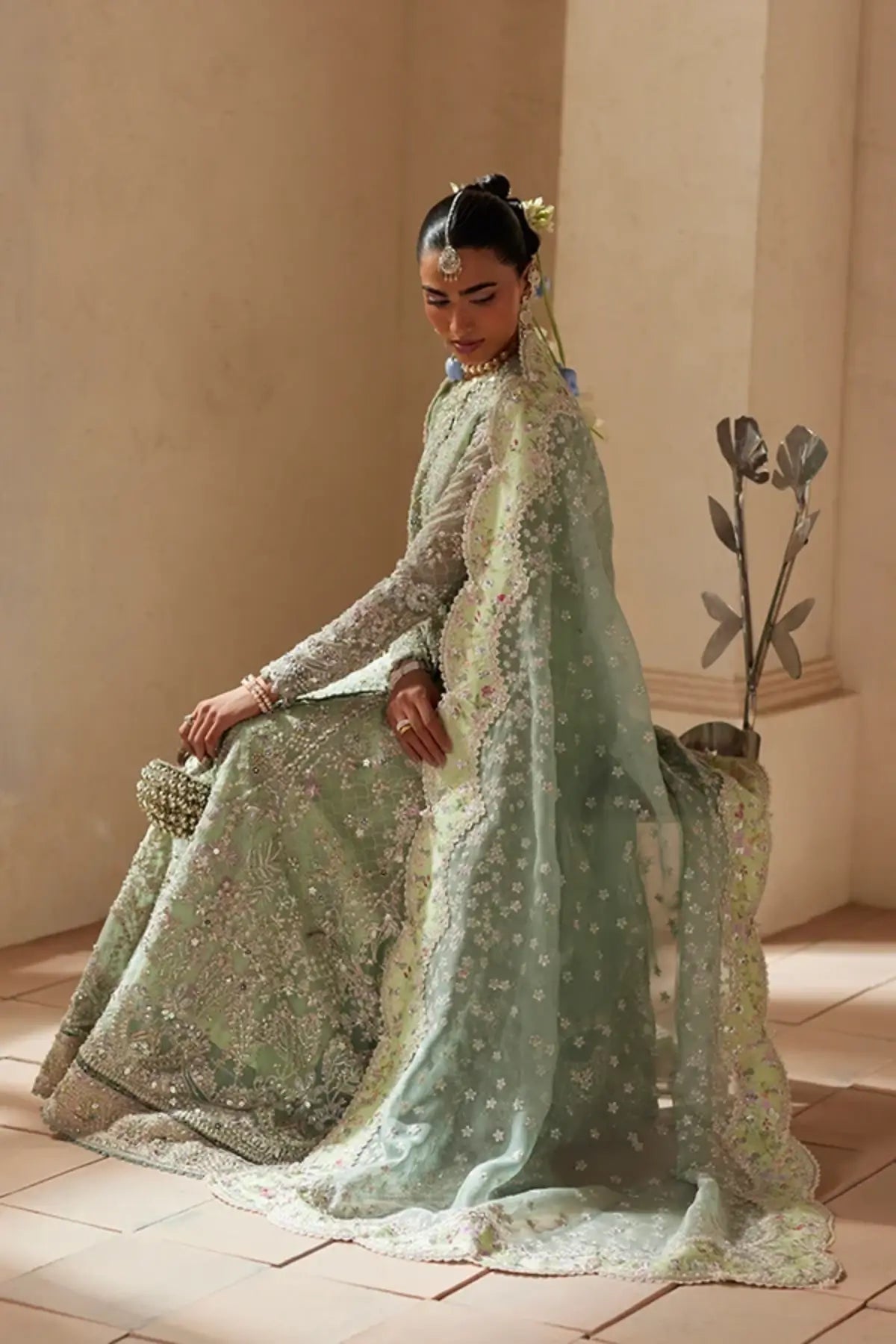 Nirvelle turquoise embellished organza Angrakha wedding suit with silk gharara and embroidered scalloped dupatta
