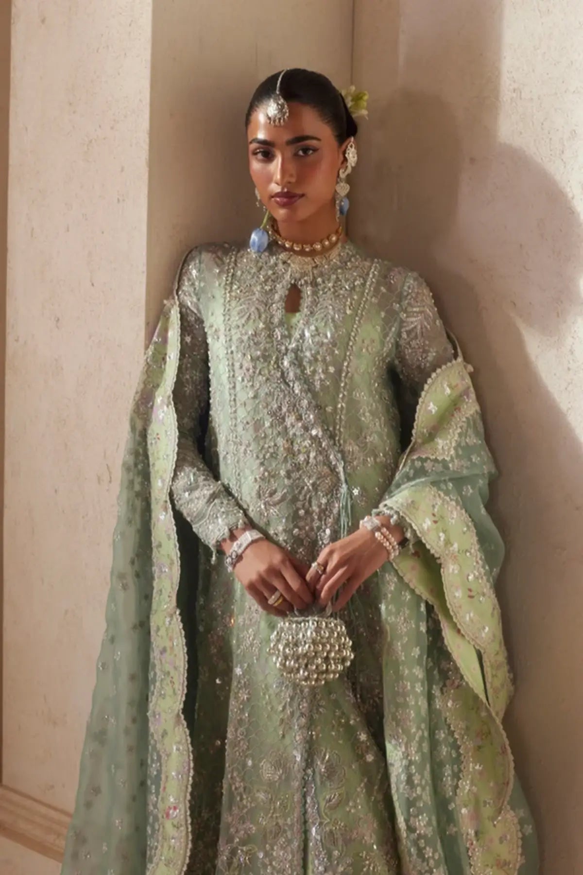 Nirvelle turquoise embellished organza Angrakha wedding suit with silk gharara and embroidered scalloped dupatta