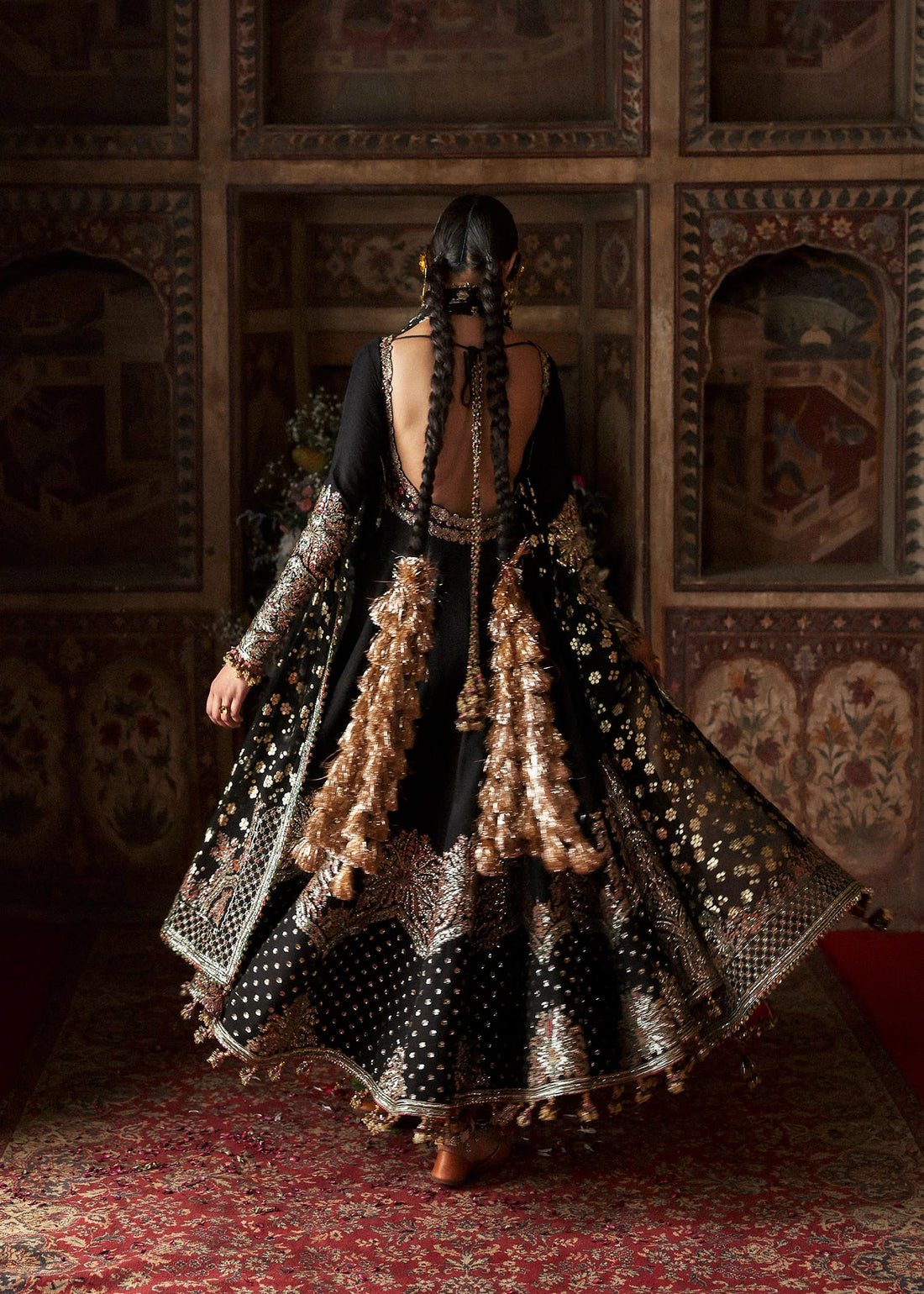 Model wearing Noor Jehan luxury black Korean raw silk embroidered peshwas with churidar and chiffon foil printed dupatta – Hussain Rehar Massarat Festive 2025.