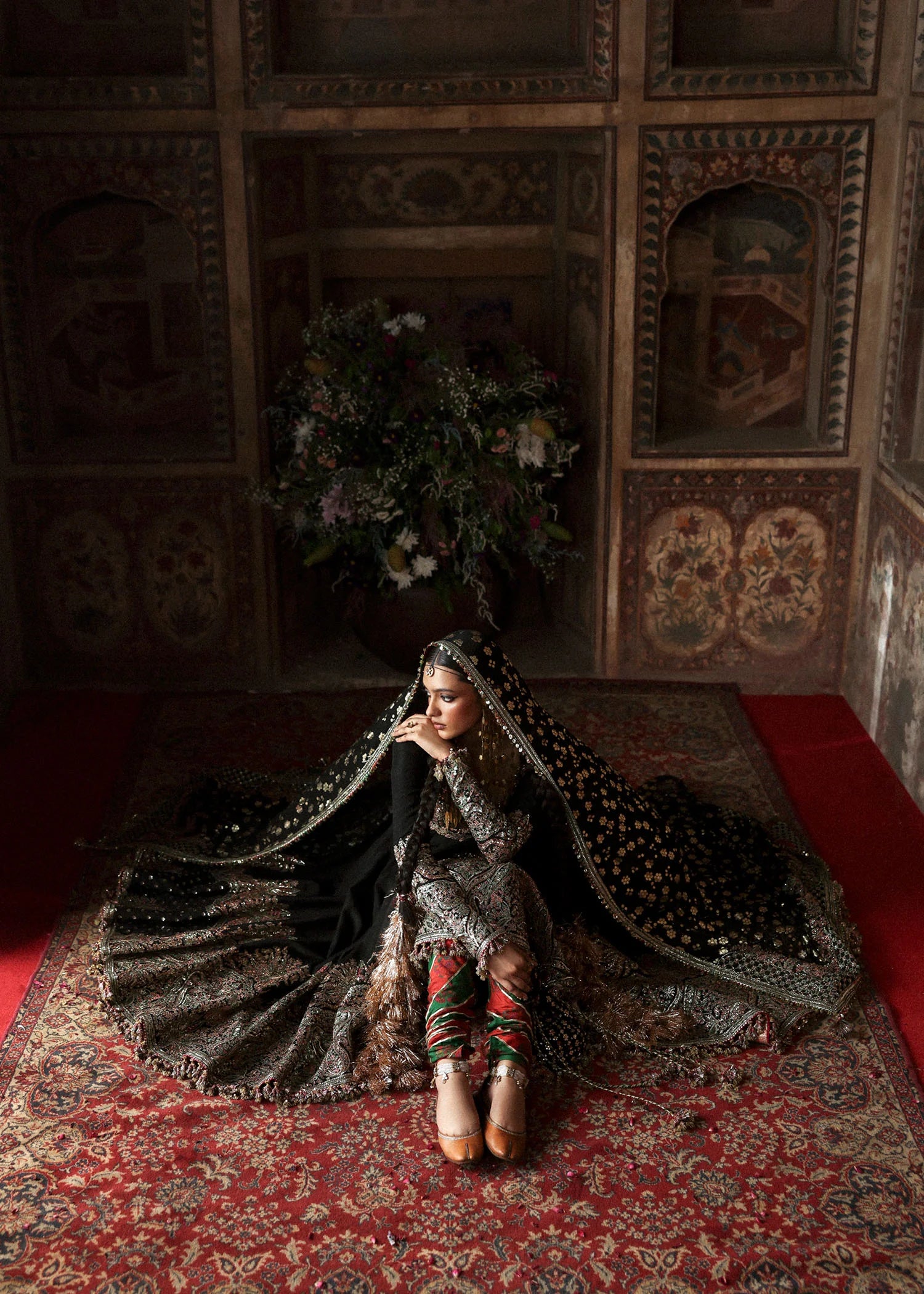 Model wearing Noor Jehan luxury black Korean raw silk embroidered peshwas with churidar and chiffon foil printed dupatta – Hussain Rehar Massarat Festive 2025.