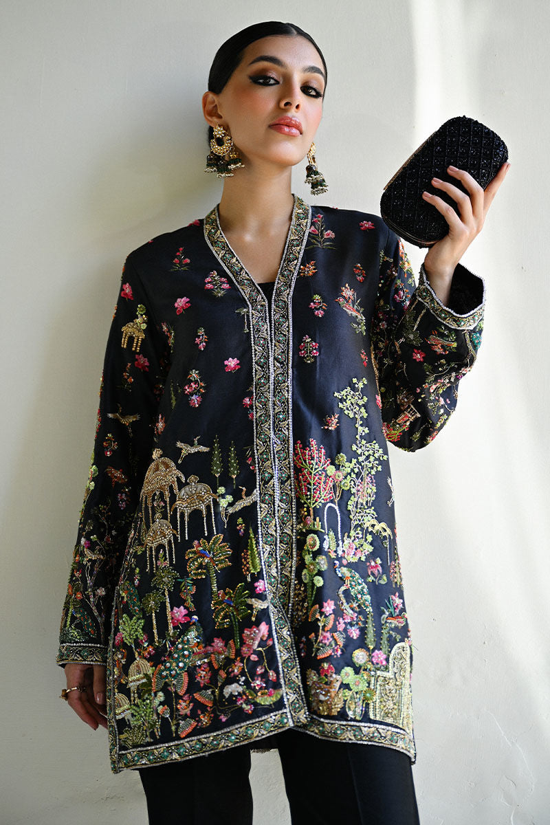 Elegant black Pakistani formal dress in raw silk with Kashmiri hand embroidery and Mughal motifs – wedding outfit for Canada, UK, USA.