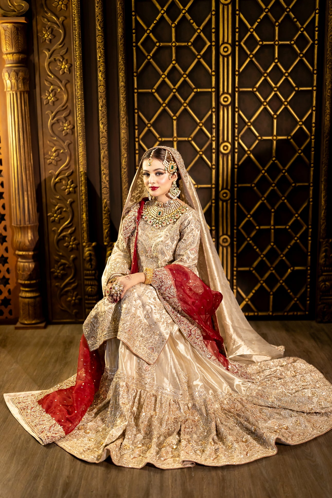 Noorjehan gold tissue bridal gharara set with red organza dupatta – Pakistani wedding outfit by MariamRaj.com.