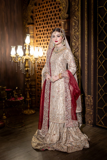 Noorjehan gold tissue bridal gharara set with red organza dupatta – Pakistani wedding outfit by MariamRaj.com.