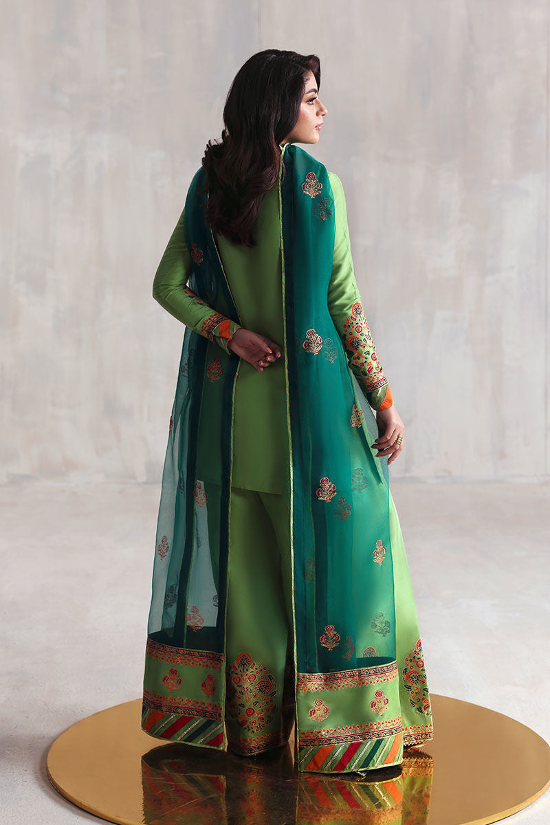 Green Pakistani block printed Korean raw silk suit with organza dupatta – 3-piece Eid outfit for women in USA, UK, Canada, and UAE.

