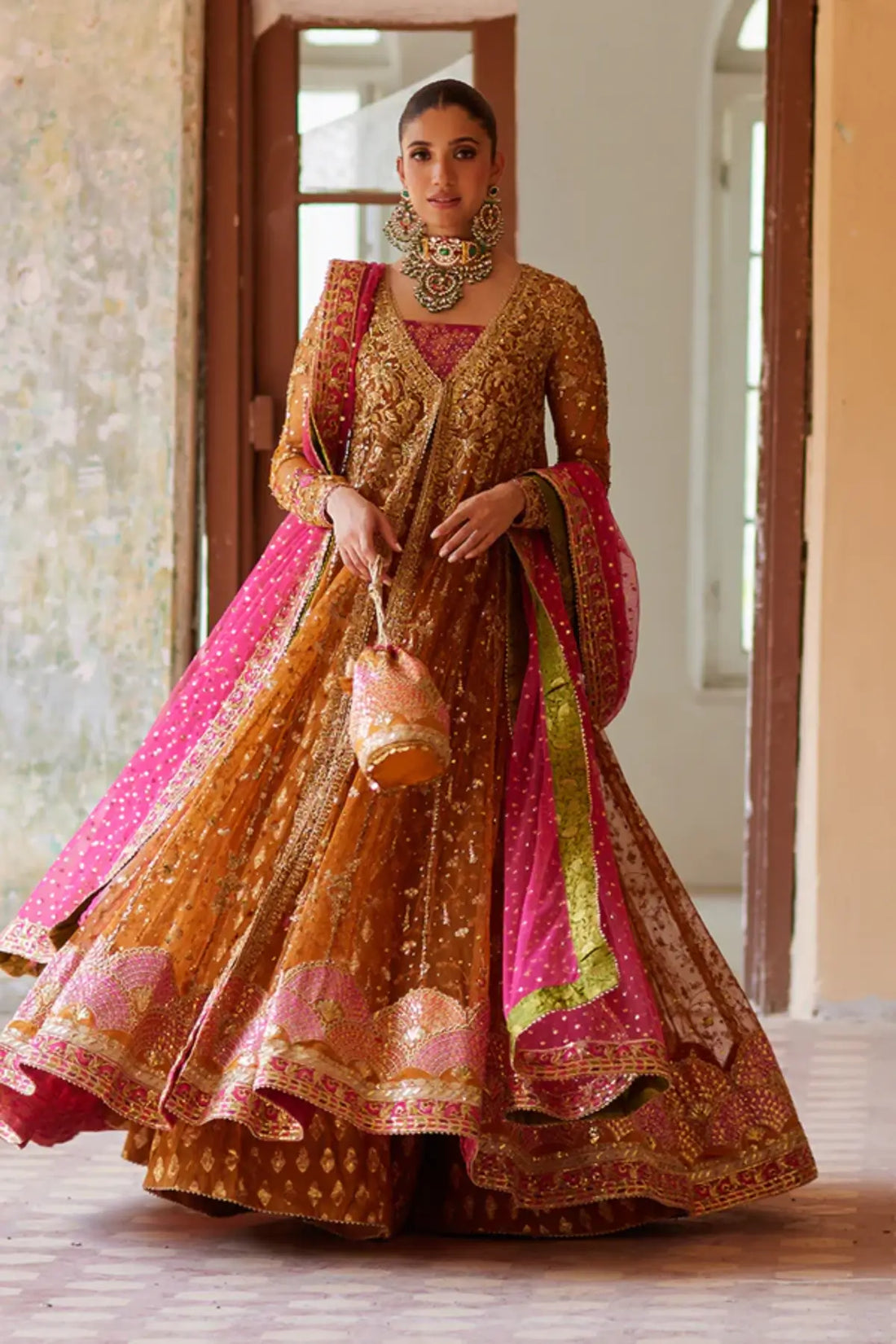 Nour Saffron Gold Pakistani Formal Net Pishwas with Zardozi Handwork, Jamawar Lehenga, Pink Net Dupatta and Embellished Potli Pouch
