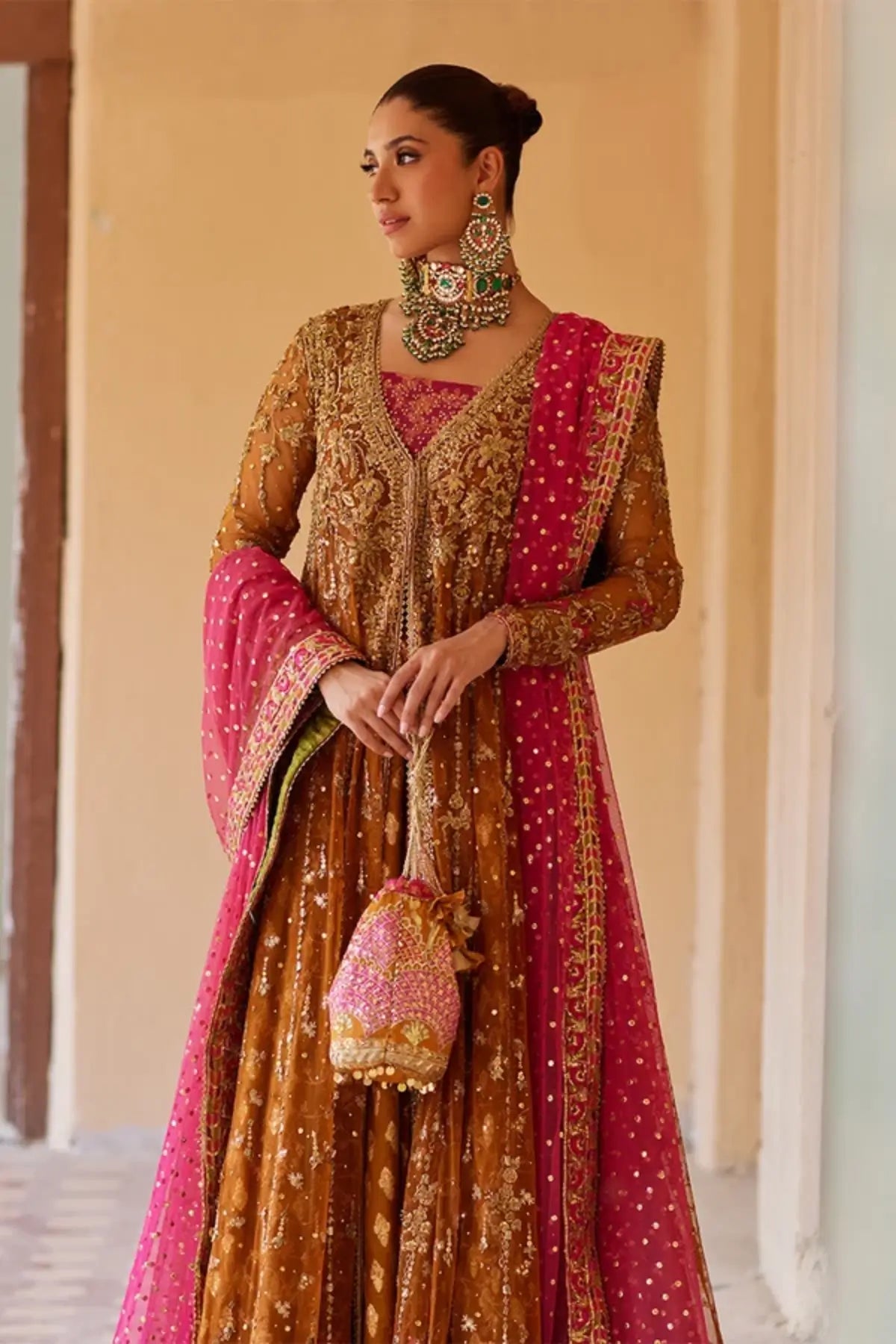 Nour Saffron Gold Pakistani Formal Net Pishwas with Zardozi Handwork, Jamawar Lehenga, Pink Net Dupatta and Embellished Potli Pouch