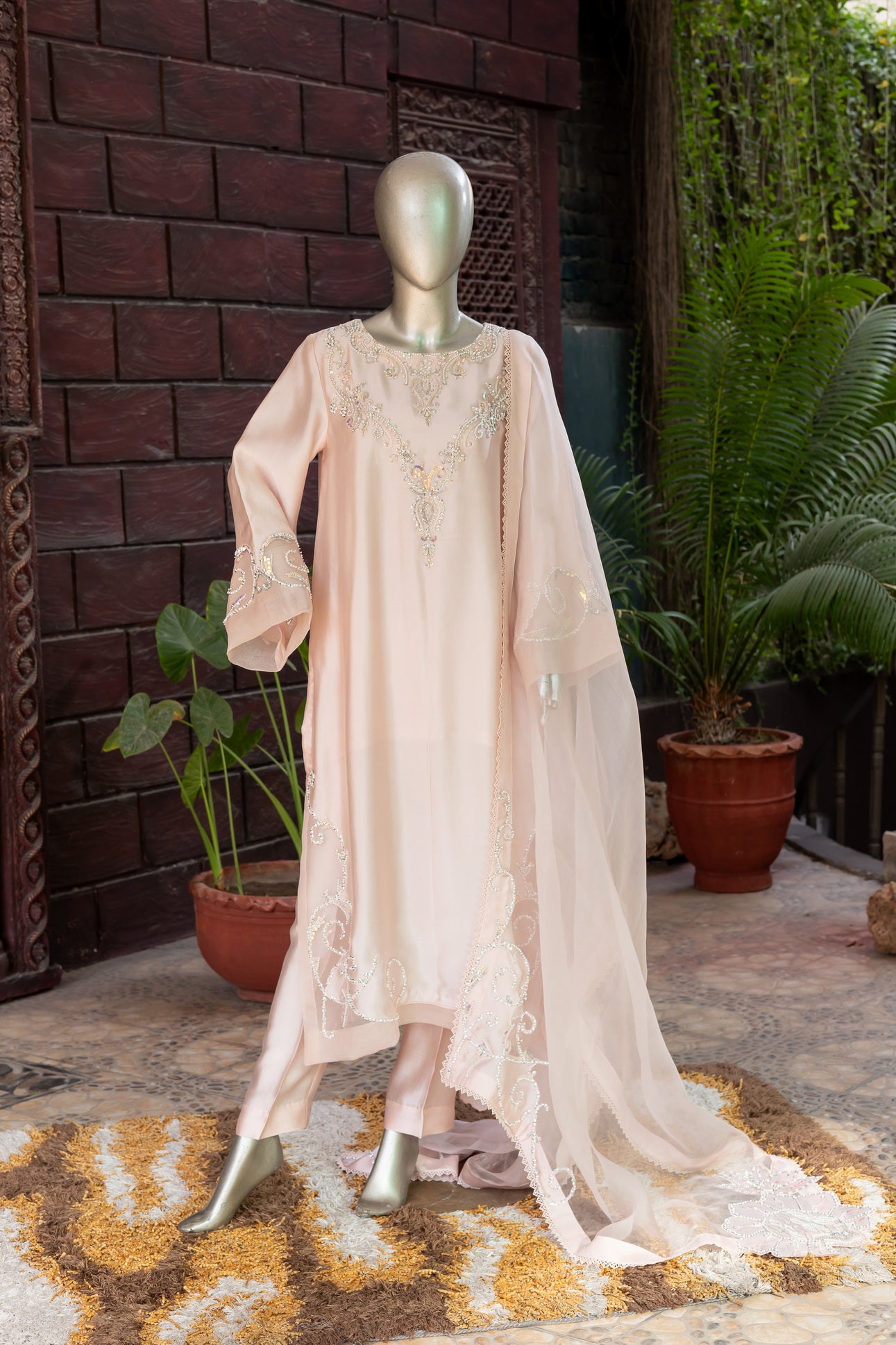 Soft blush pink designer Pakistani silk suit by MariamRaj with embroidered sheesha silk shirt and trousers, paired with a scalloped organza dupatta for women in USA and UK.