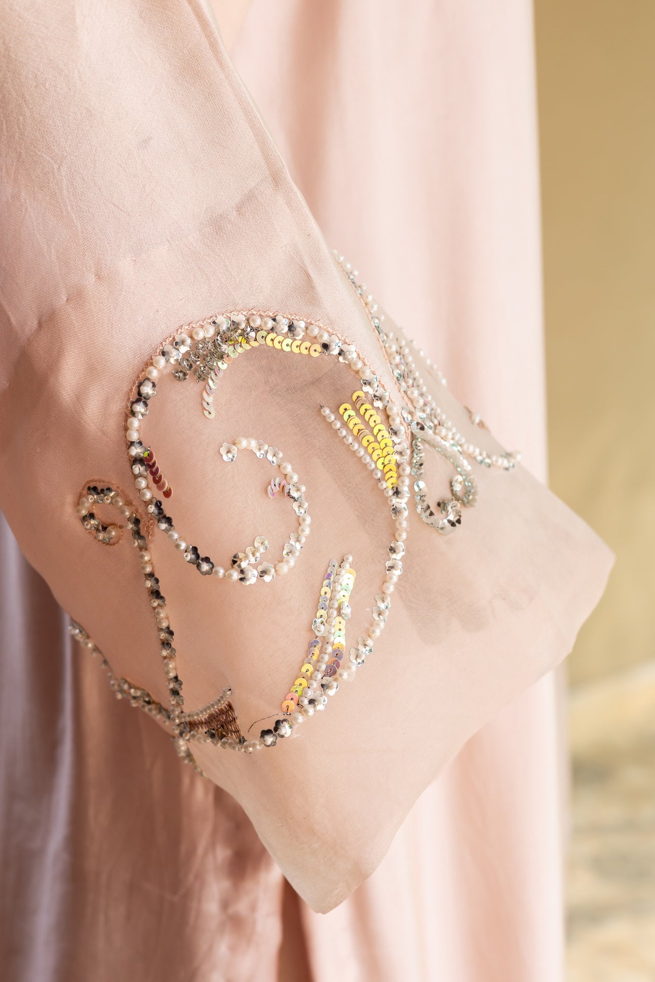 Soft blush pink designer Pakistani silk suit by MariamRaj with embroidered sheesha silk shirt and trousers, paired with a scalloped organza dupatta for women in USA and UK.