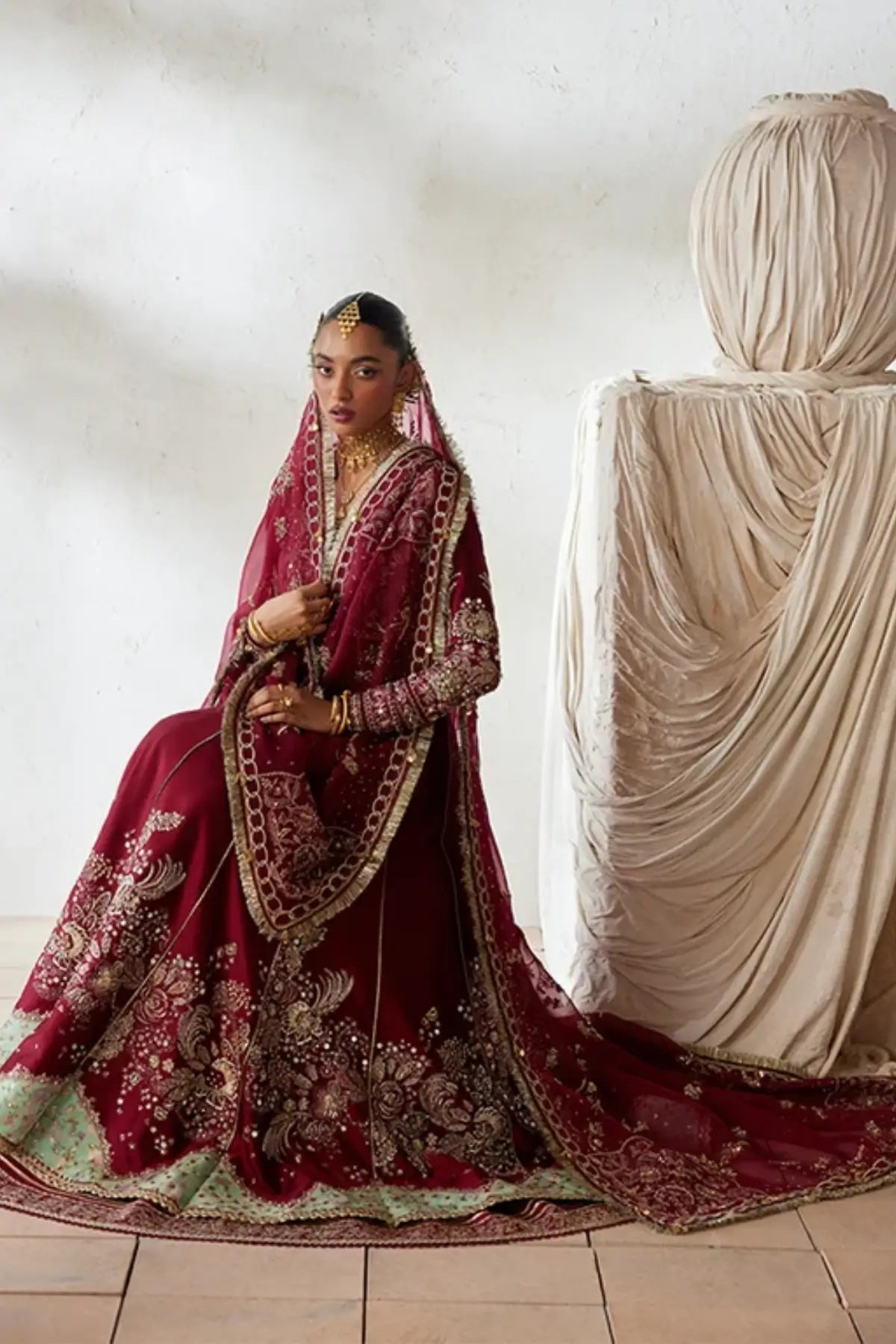 Nusha deep red embellished sheesha silk wedding pishwas with silver embroidery, raw silk lehenga and gold floral organza dupatta