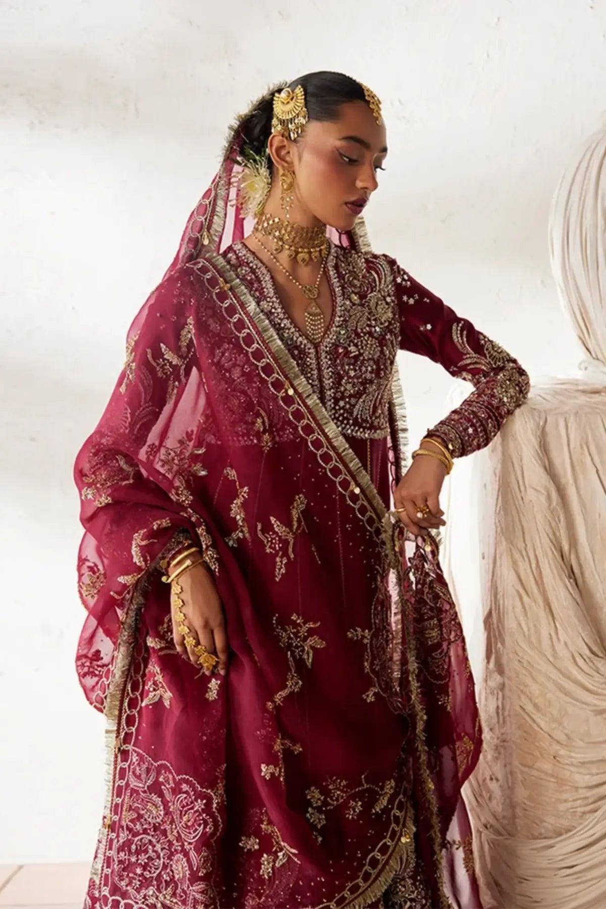 Nusha deep red embellished sheesha silk wedding pishwas with silver embroidery, raw silk lehenga and gold floral organza dupatta
