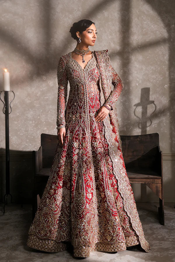 Pakistani bridal pishwas with raw silk lehenga for USA brides, featuring hand-embellished naqshi, dabka, mirror work, and mukesh with a sheer net dupatta in a graceful traditional design.
