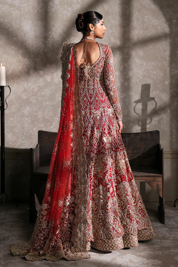 Pakistani bridal pishwas with raw silk lehenga for USA brides, featuring hand-embellished naqshi, dabka, mirror work, and mukesh with a sheer net dupatta in a graceful traditional design.