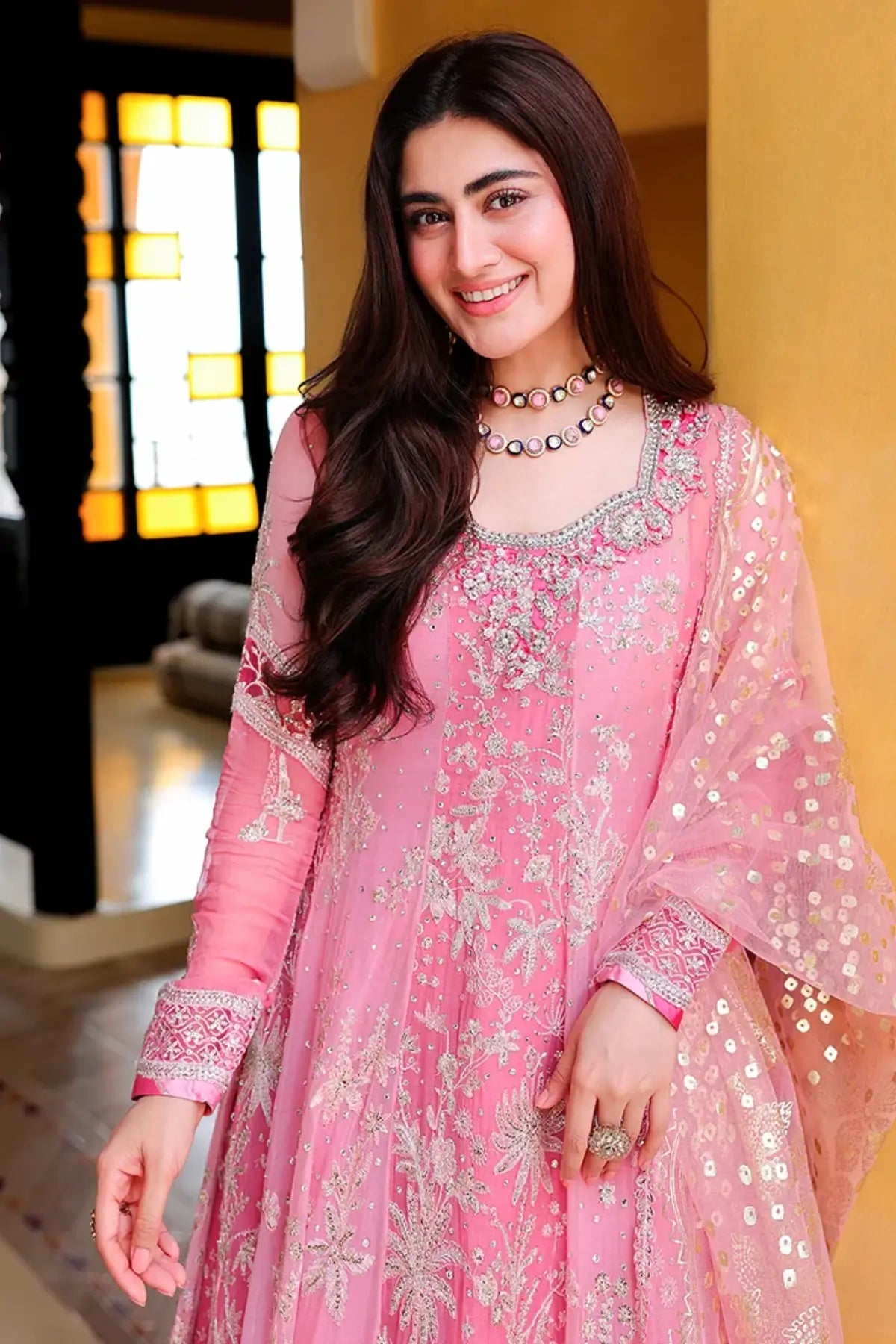 Pink Promise pink embellished sequinned chiffon Eid formal stitched dress with handworked neckline, raw silk trouser and foil printed net dupatta