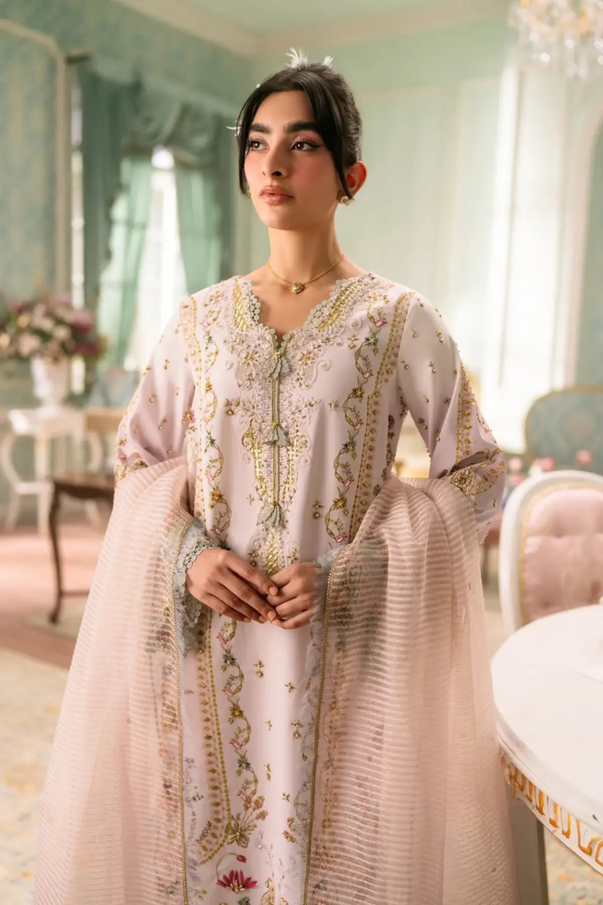 QSL-07 Noa ivory embellished Charmeuse silk suit with handmade embroidery, Rocket Net dupatta and raw silk trouser.