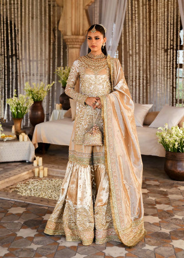 RESHAM – Gold bridal gharara suit in tissue with embroidery and dupatta. Stitched Pakistani wedding outfit online at Pakistanimoda.